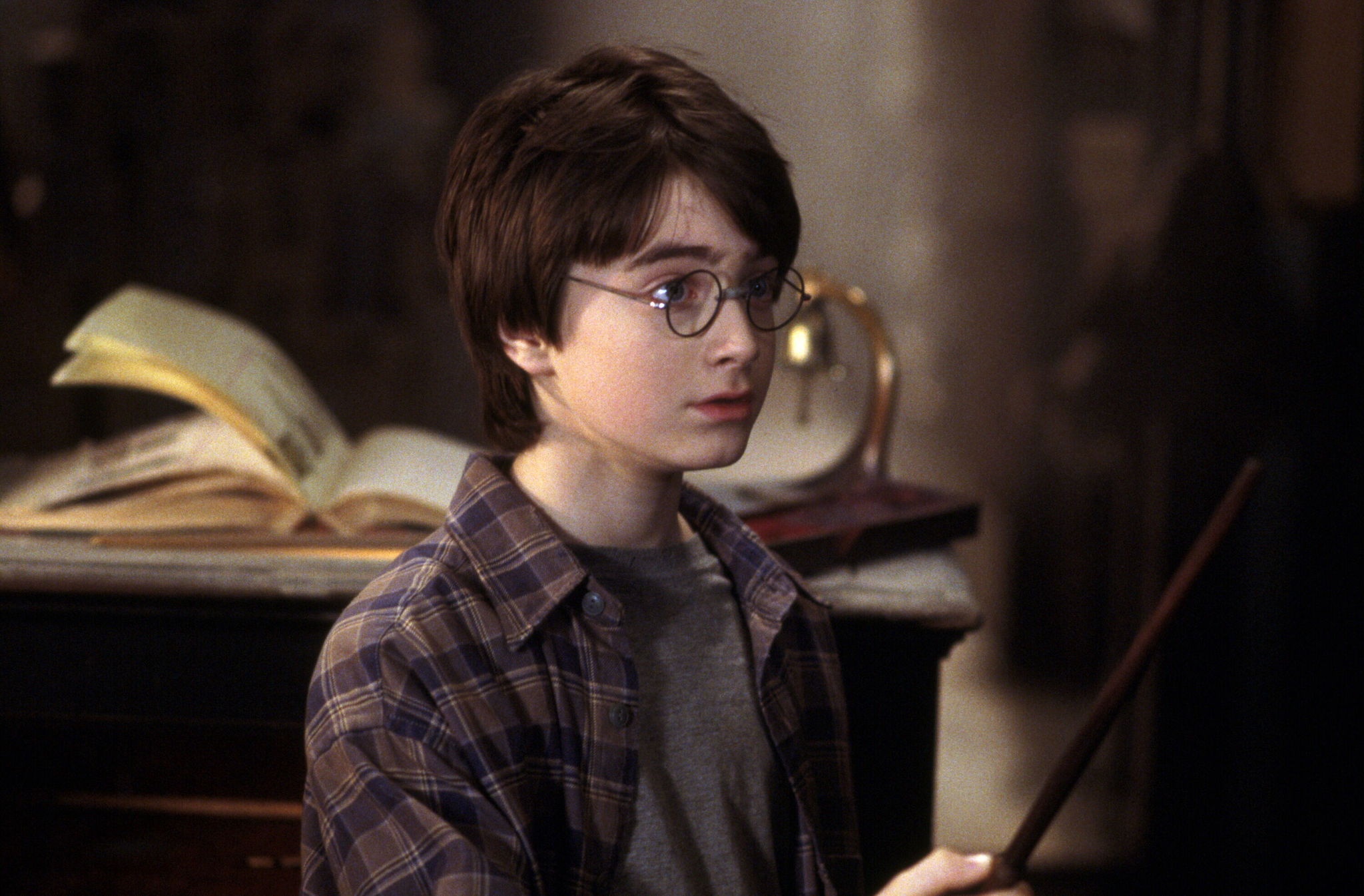 Harry Potter from Harry Potter holding a wand HD Wallpaper