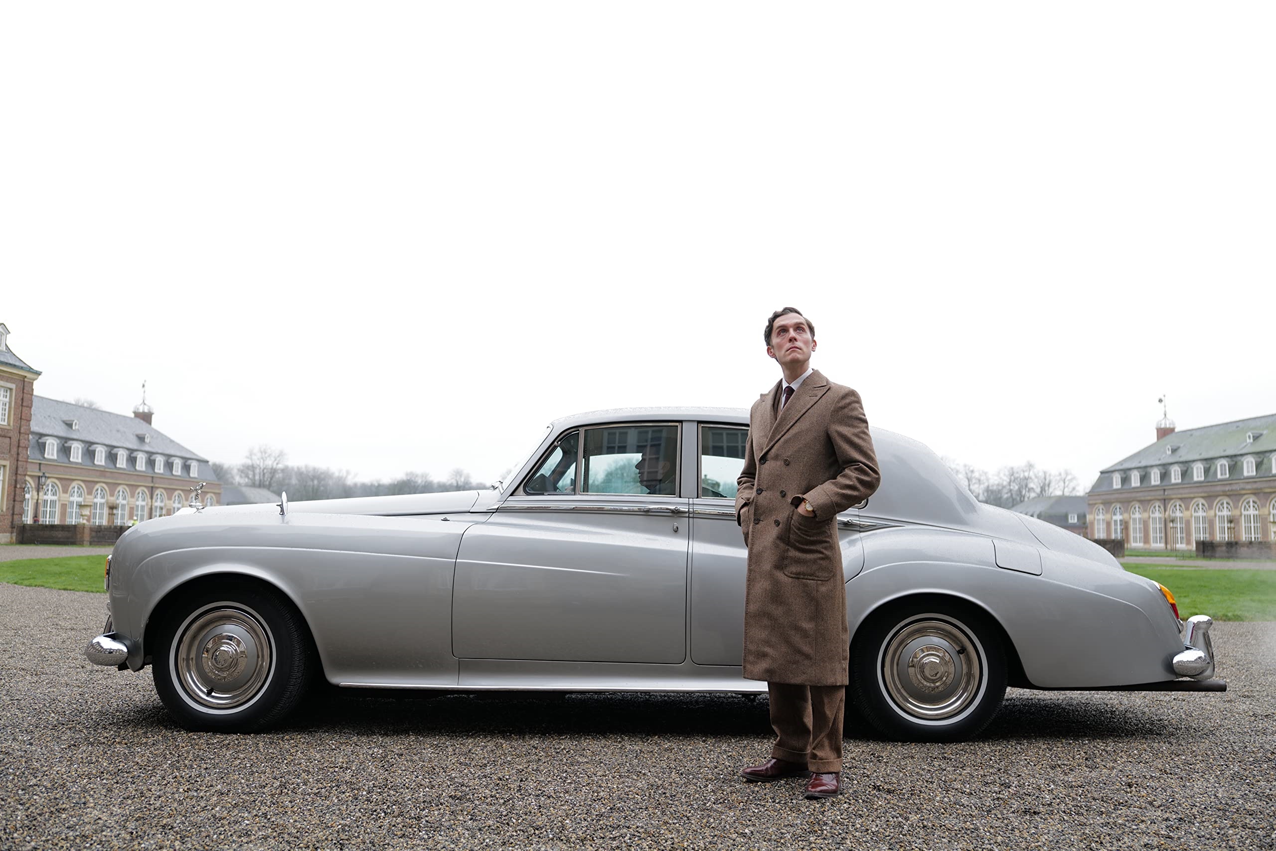 Jack Farthing in a vintage car HD Wallpaper