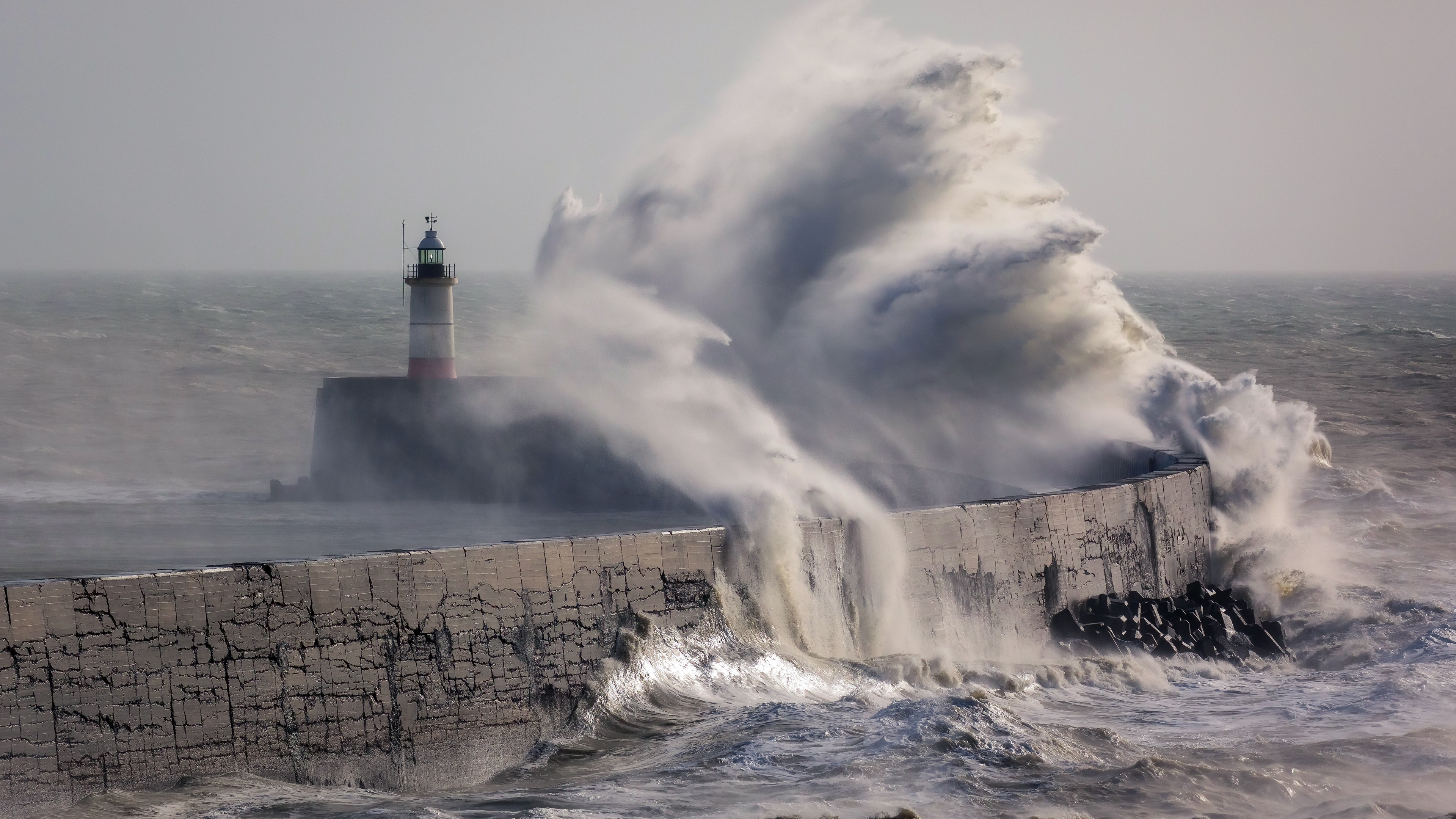 Lighthouse in a Storm with Crashing Waves HD Wallpaper
