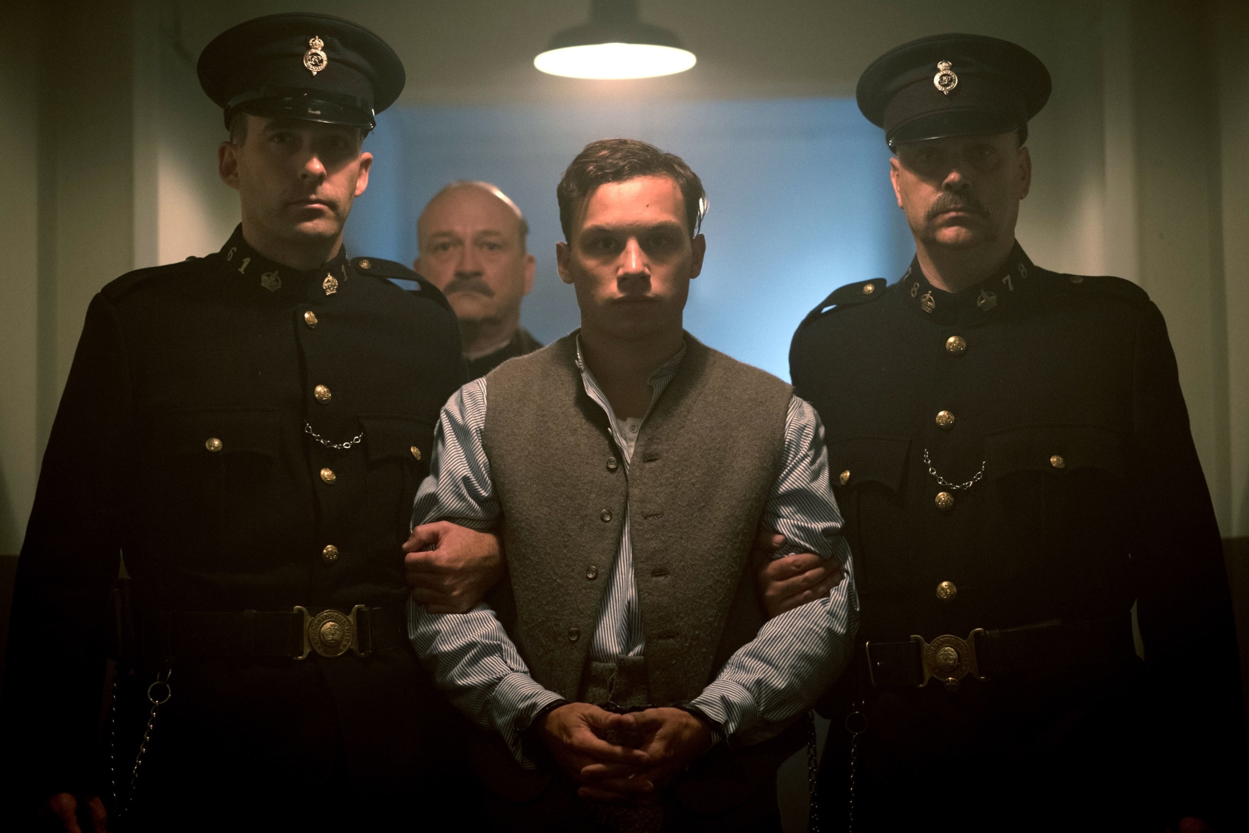 Man being escorted by police officers HD Wallpaper