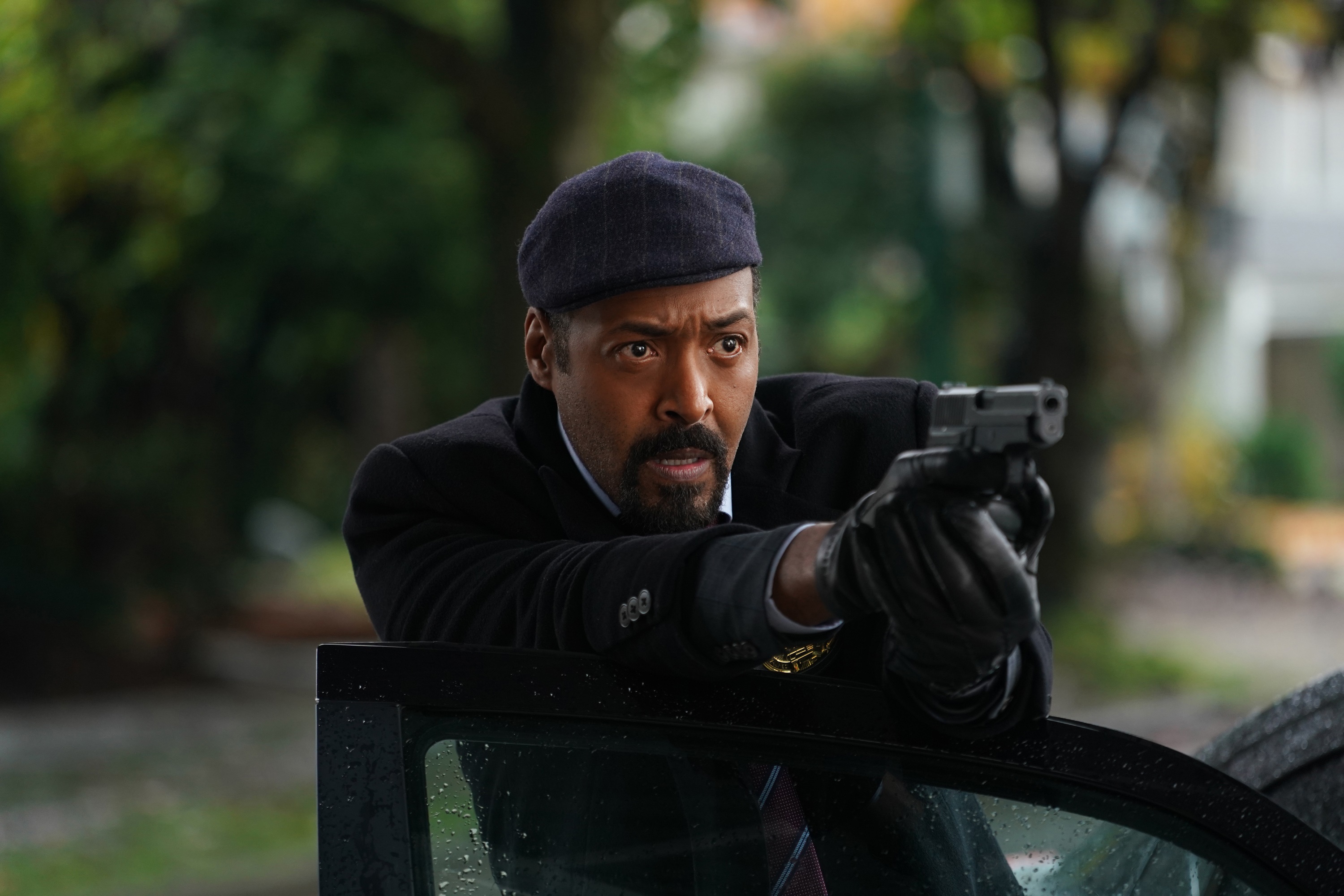 Joe West from The Flash aiming a gun HD Wallpaper