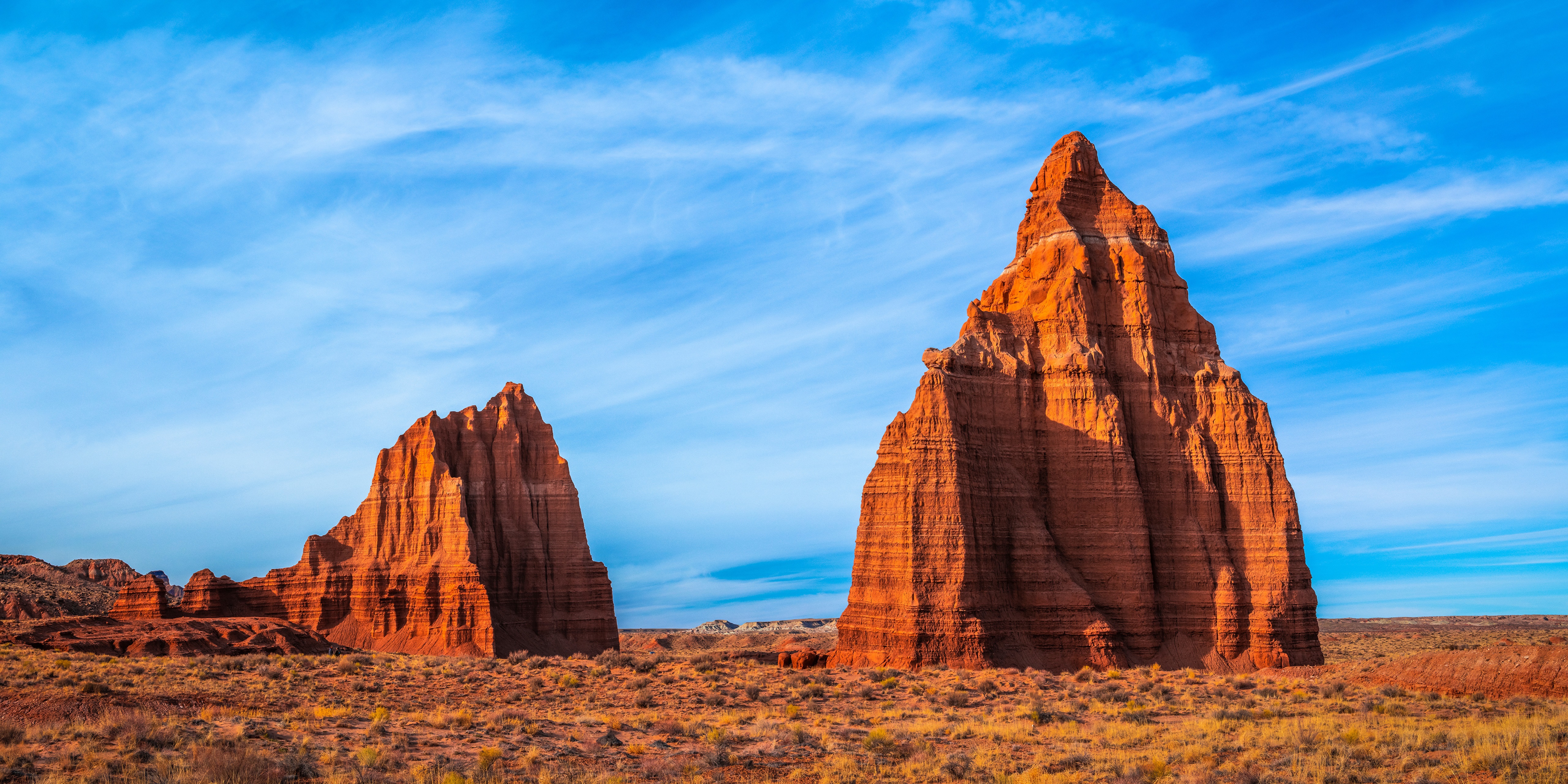Desert rock formations under a blue sky HD Wallpaper