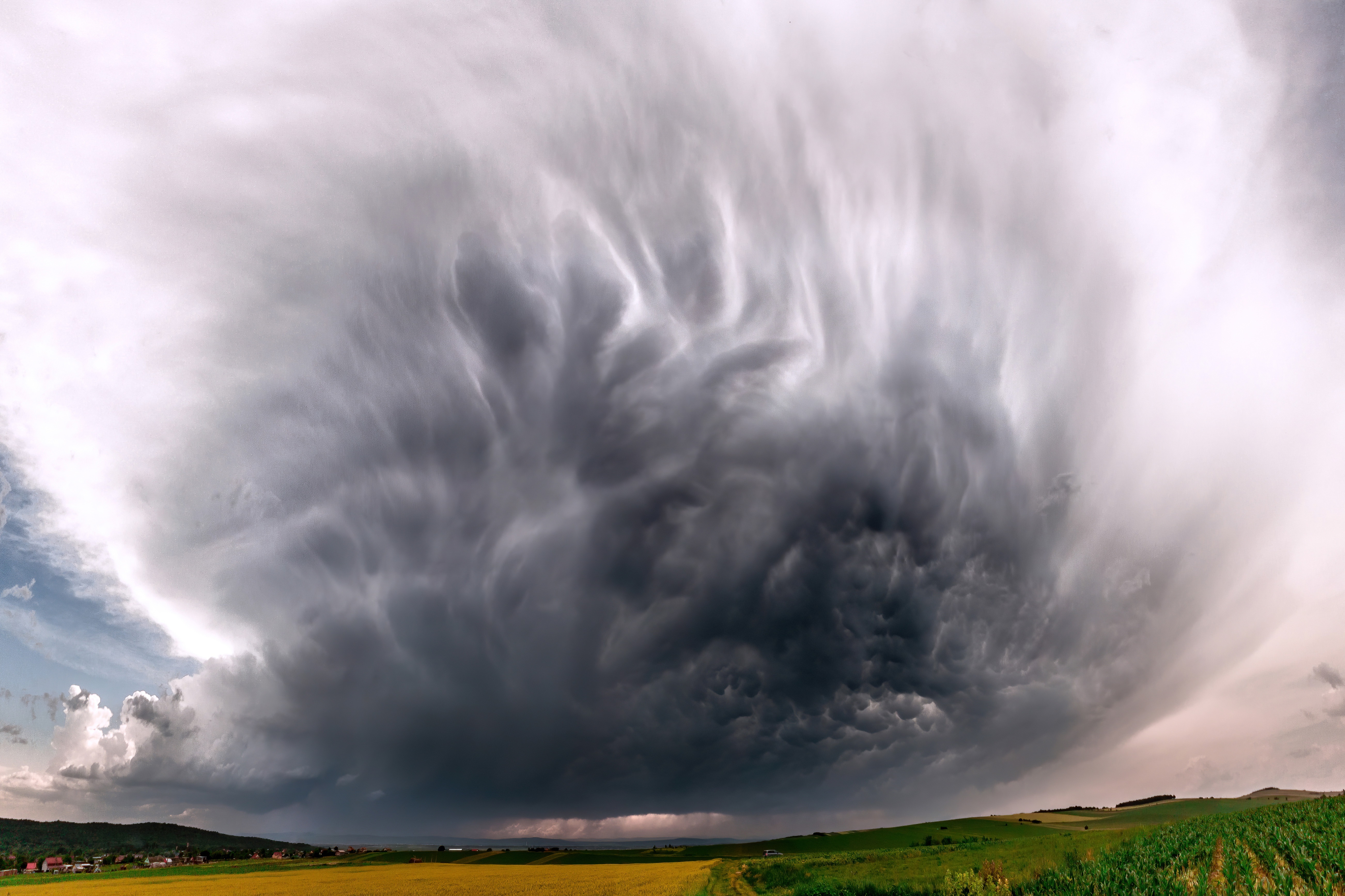 Mammatus Clouds Over Rural Landscape 4K HD Wallpaper