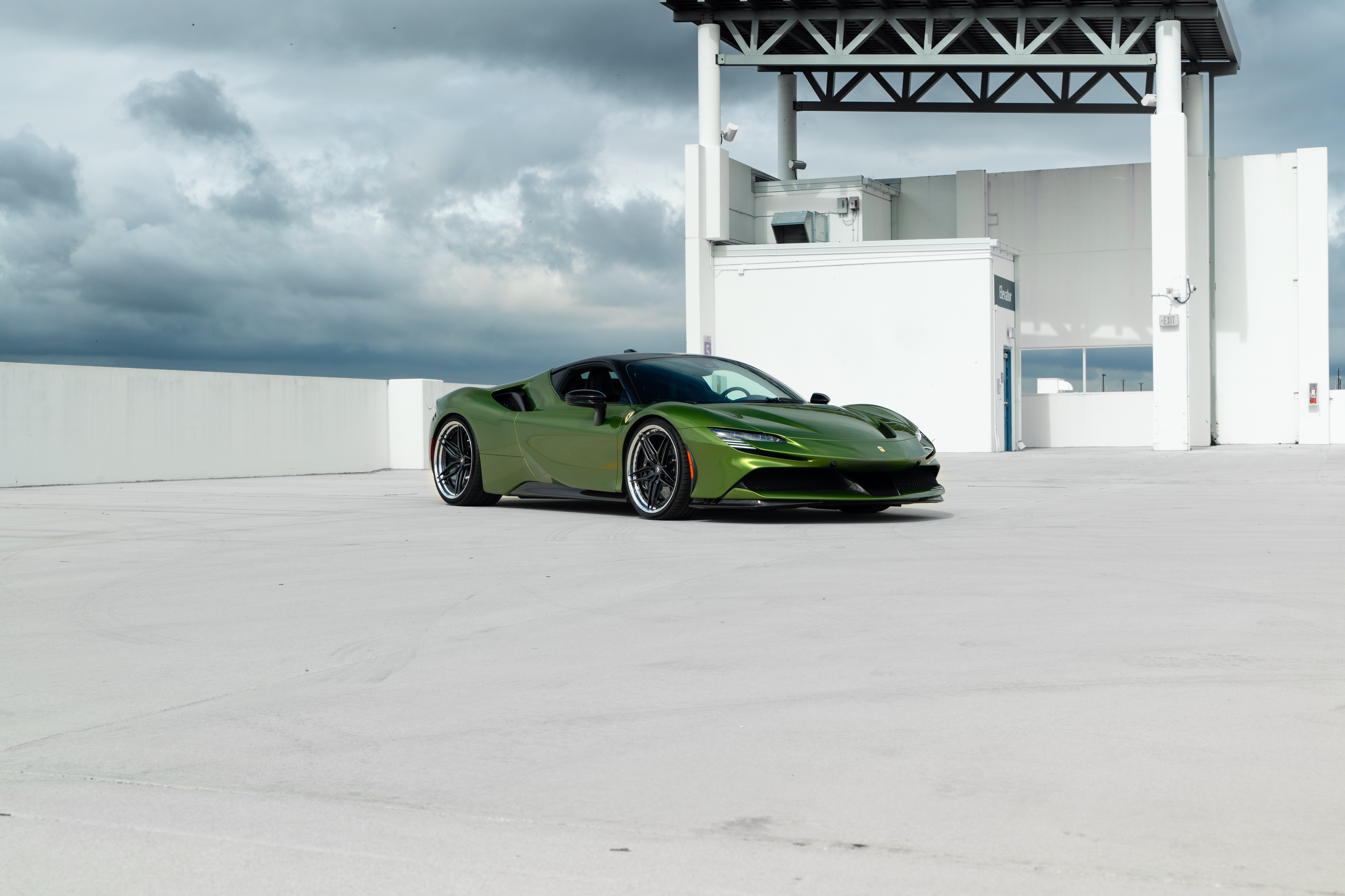 Green Ferrari SF90 Stradale parked on rooftop HD Wallpaper