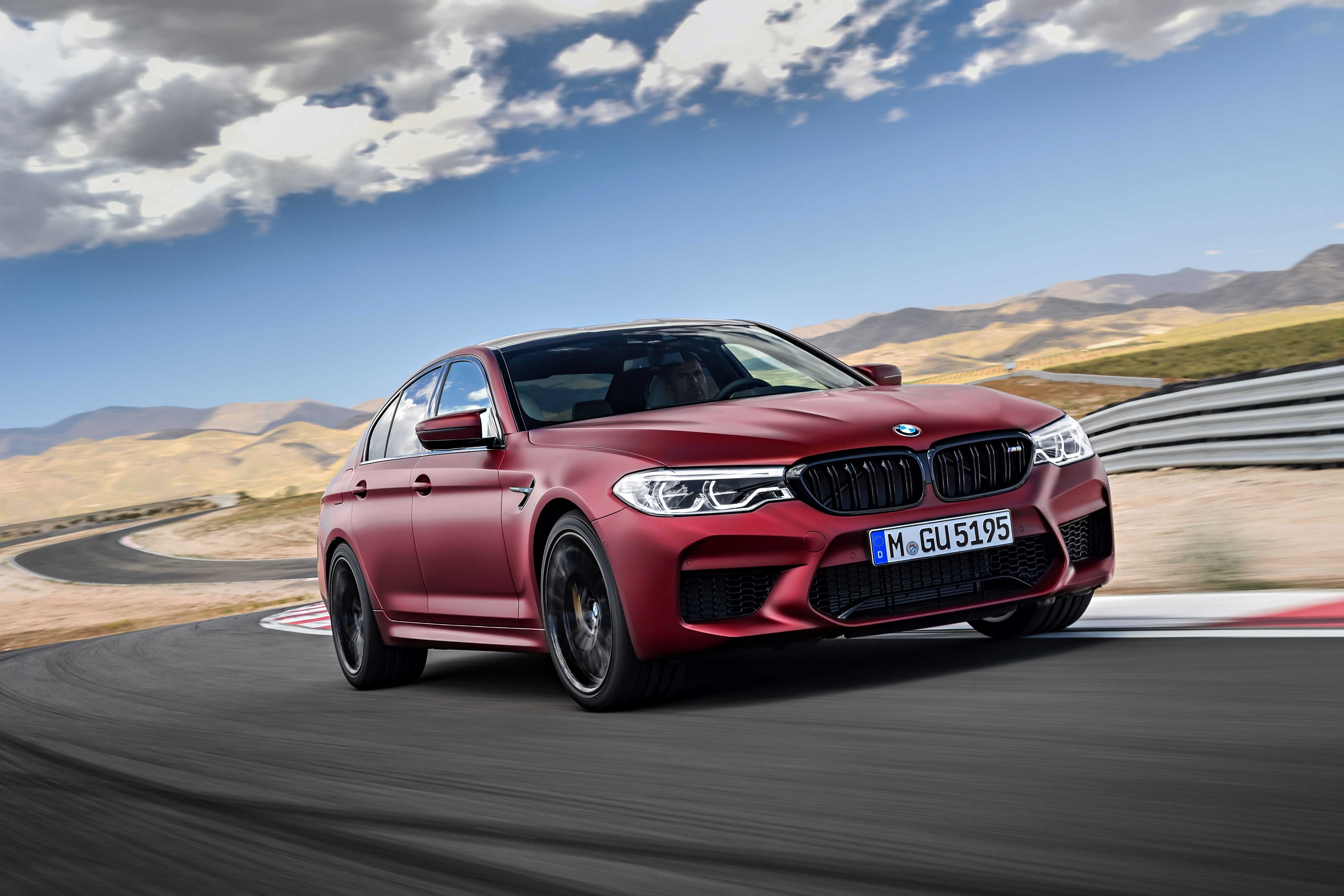 Red BMW M5 on a Racetrack HD Wallpaper