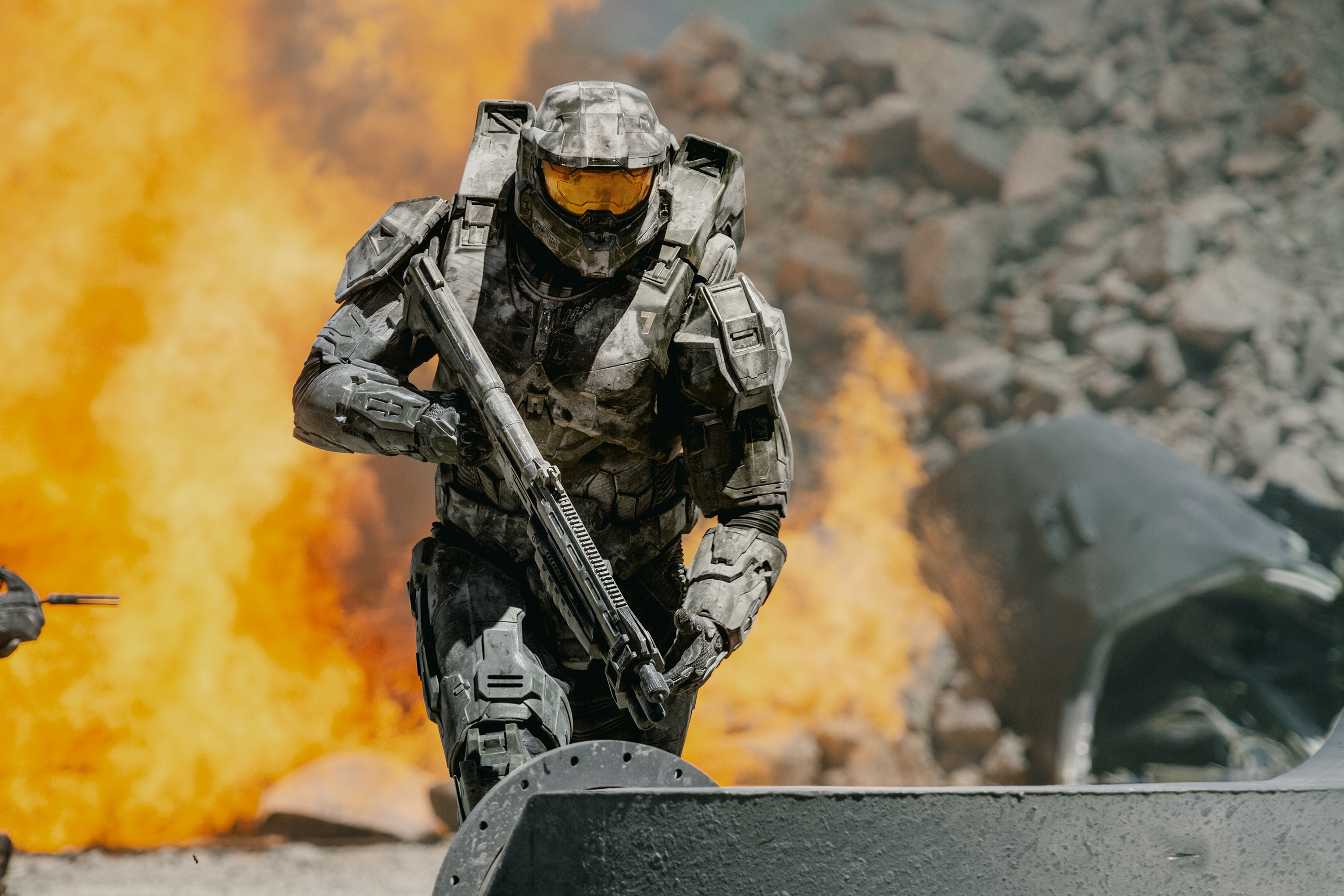 Master Chief from Halo in a fiery battlefield HD Wallpaper
