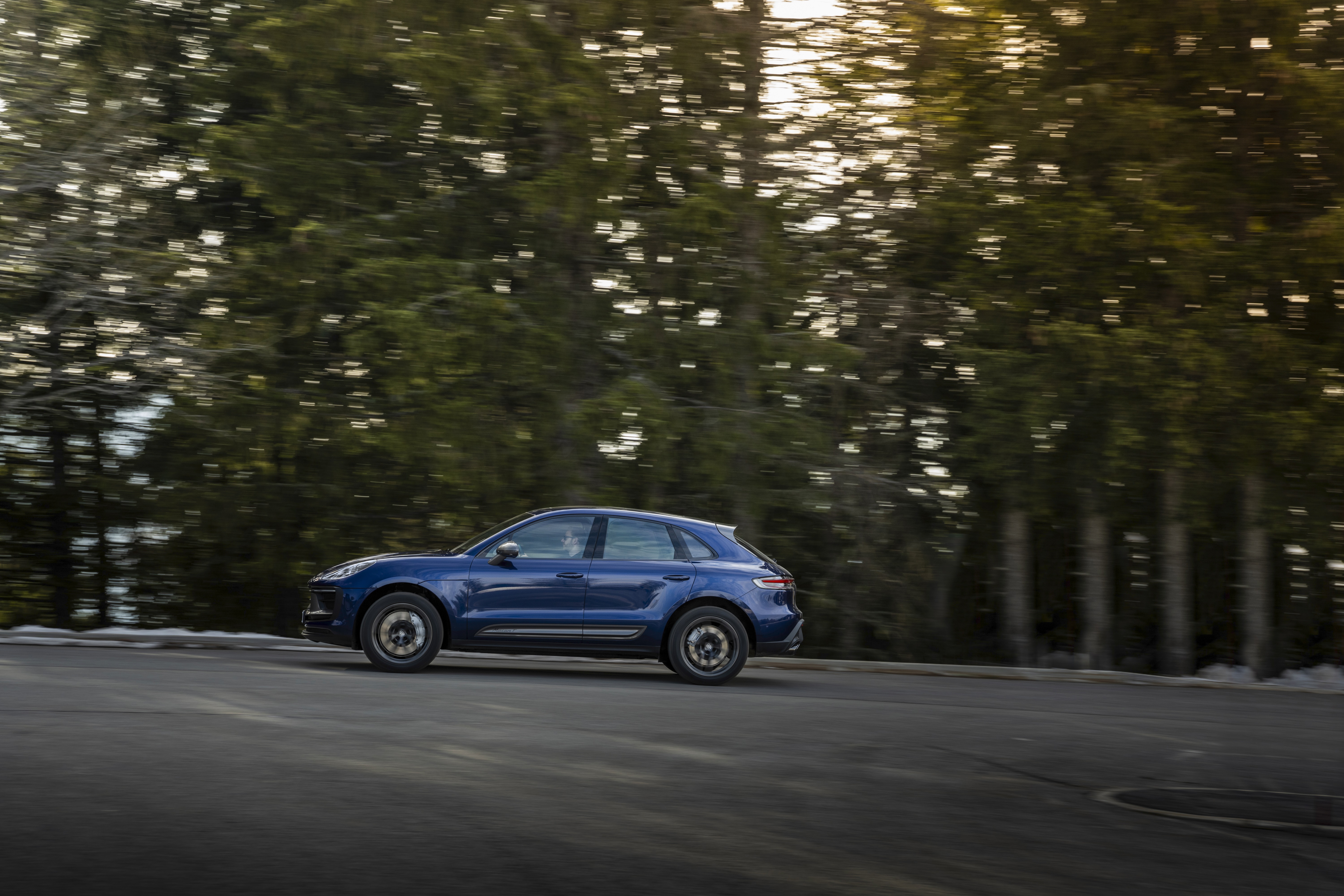 Blue Porsche Macan Turbo driving on a road HD Wallpaper