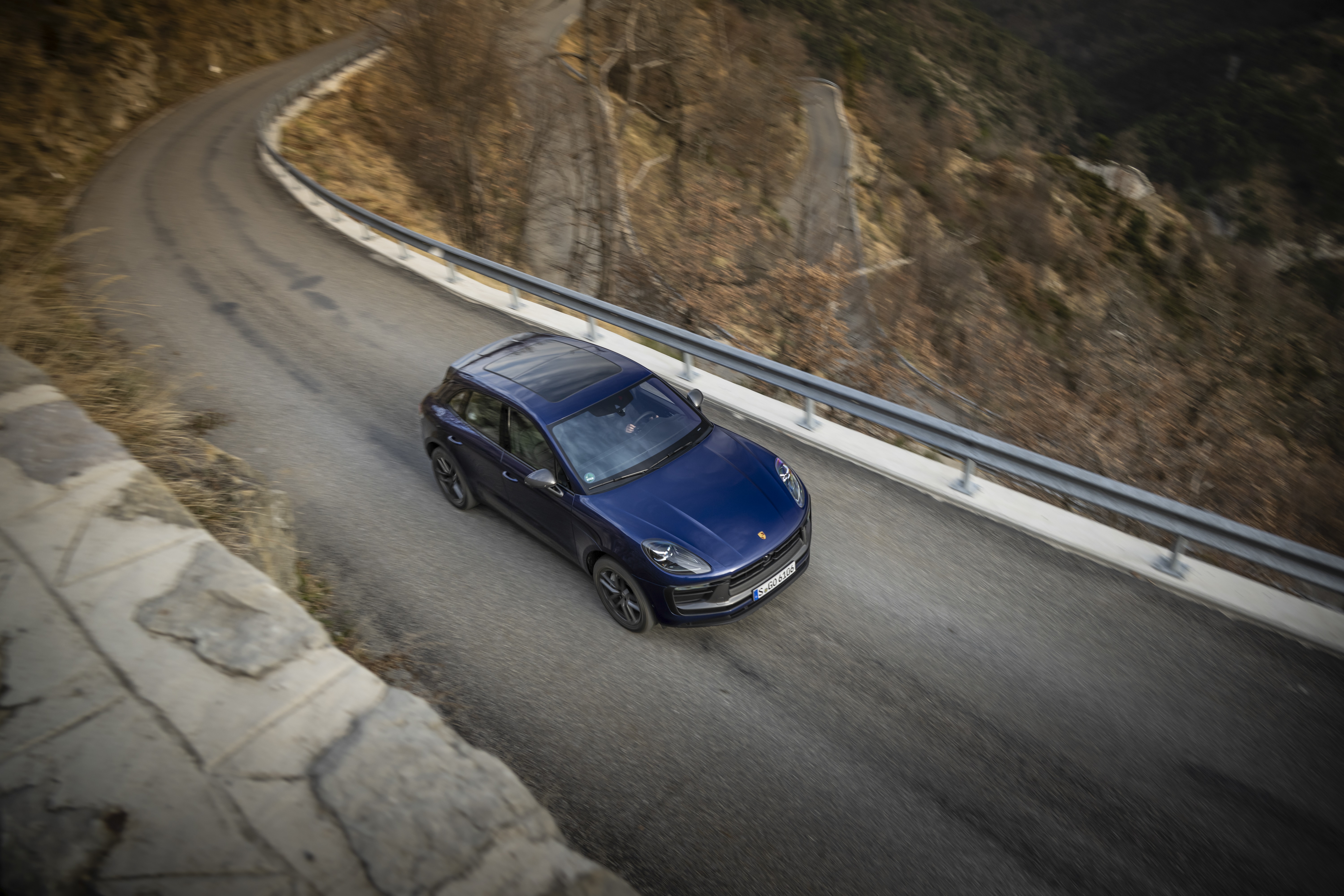 Blue Porsche Macan Turbo on a mountain road HD Wallpaper