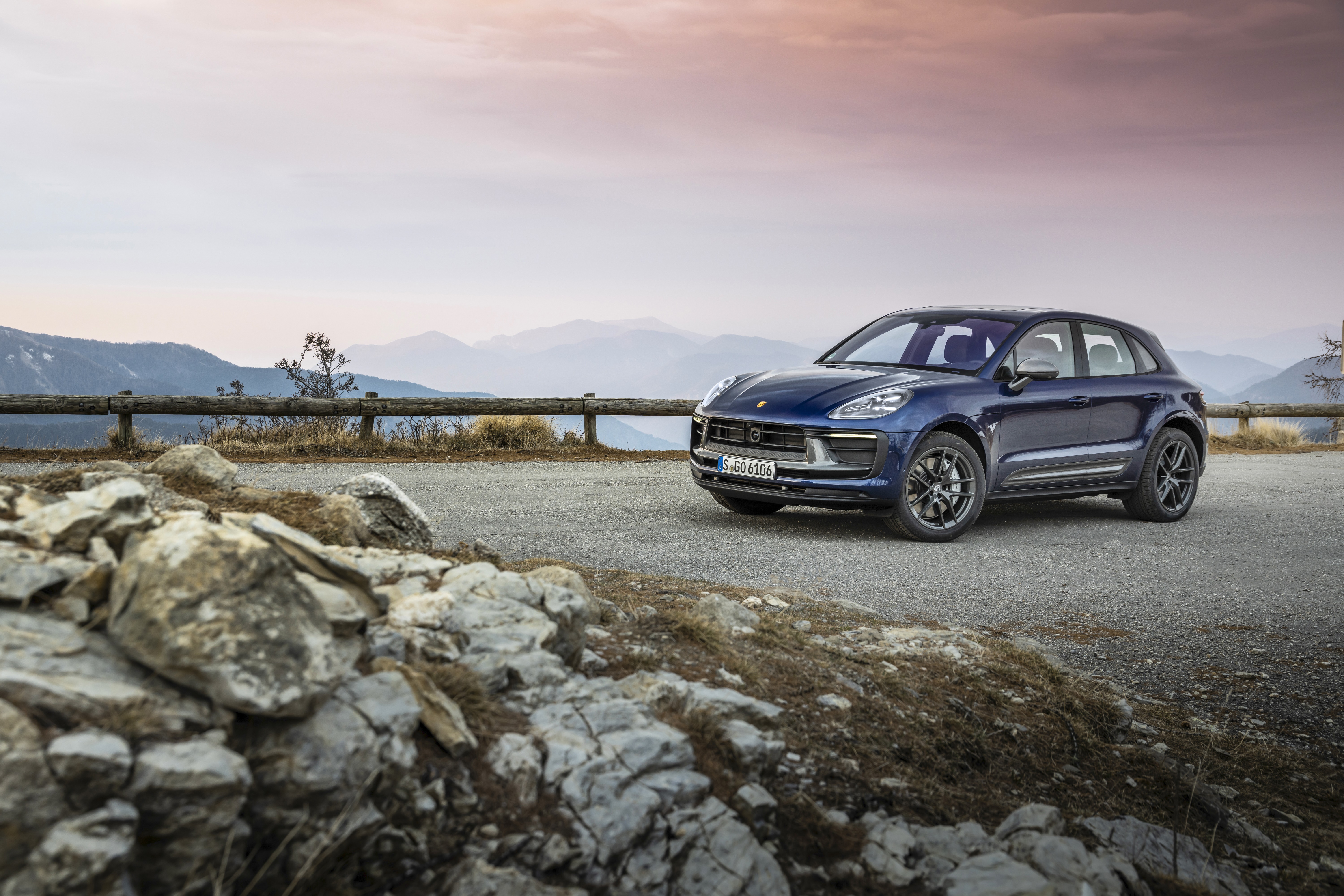 Blue Porsche Macan Turbo SUV on a mountain road HD Wallpaper