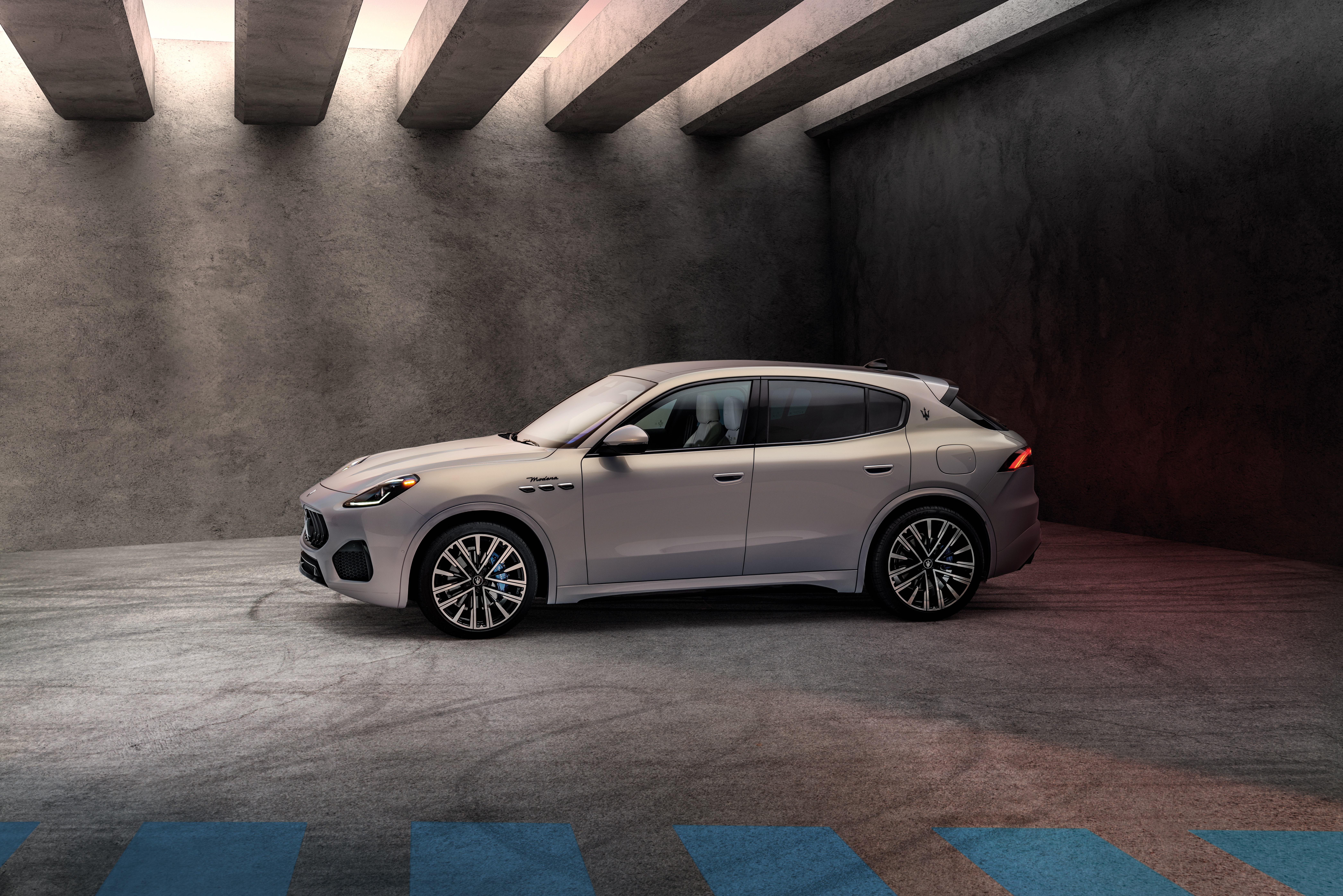 Maserati Grecale Modena SUV in concrete garage HD Wallpaper