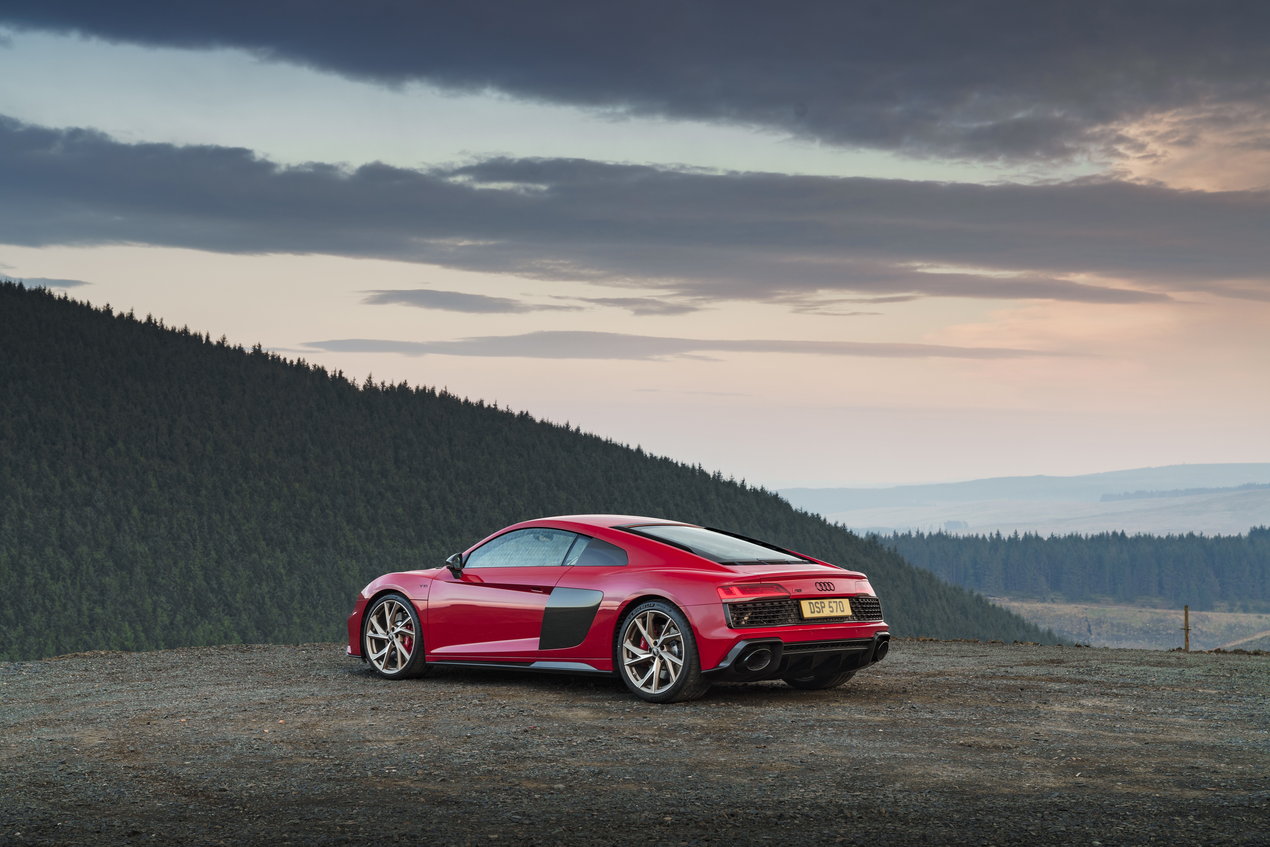 Red Audi R8 V10 parked on a gravel overlook HD Wallpaper
