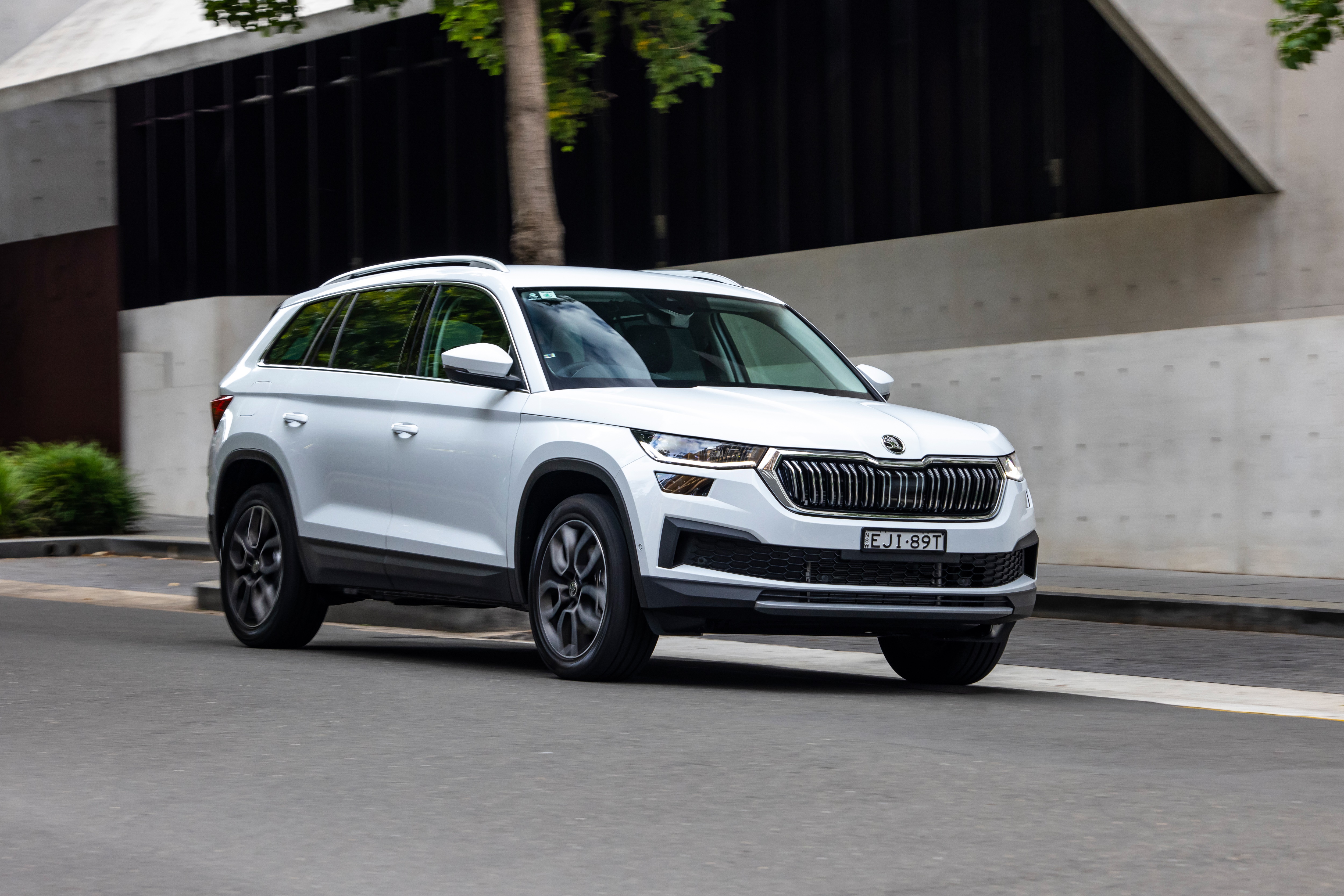 White Skoda Kodiaq driving on a street HD Wallpaper