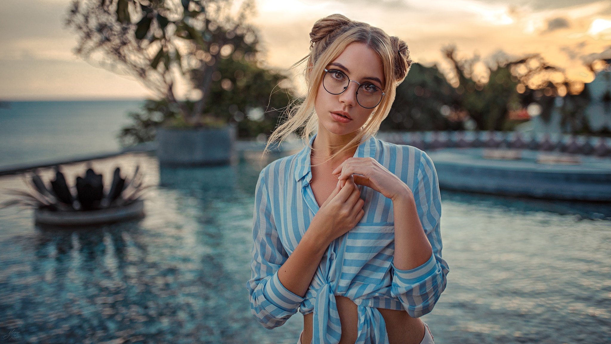 Woman with buns and glasses by the pool HD Wallpaper