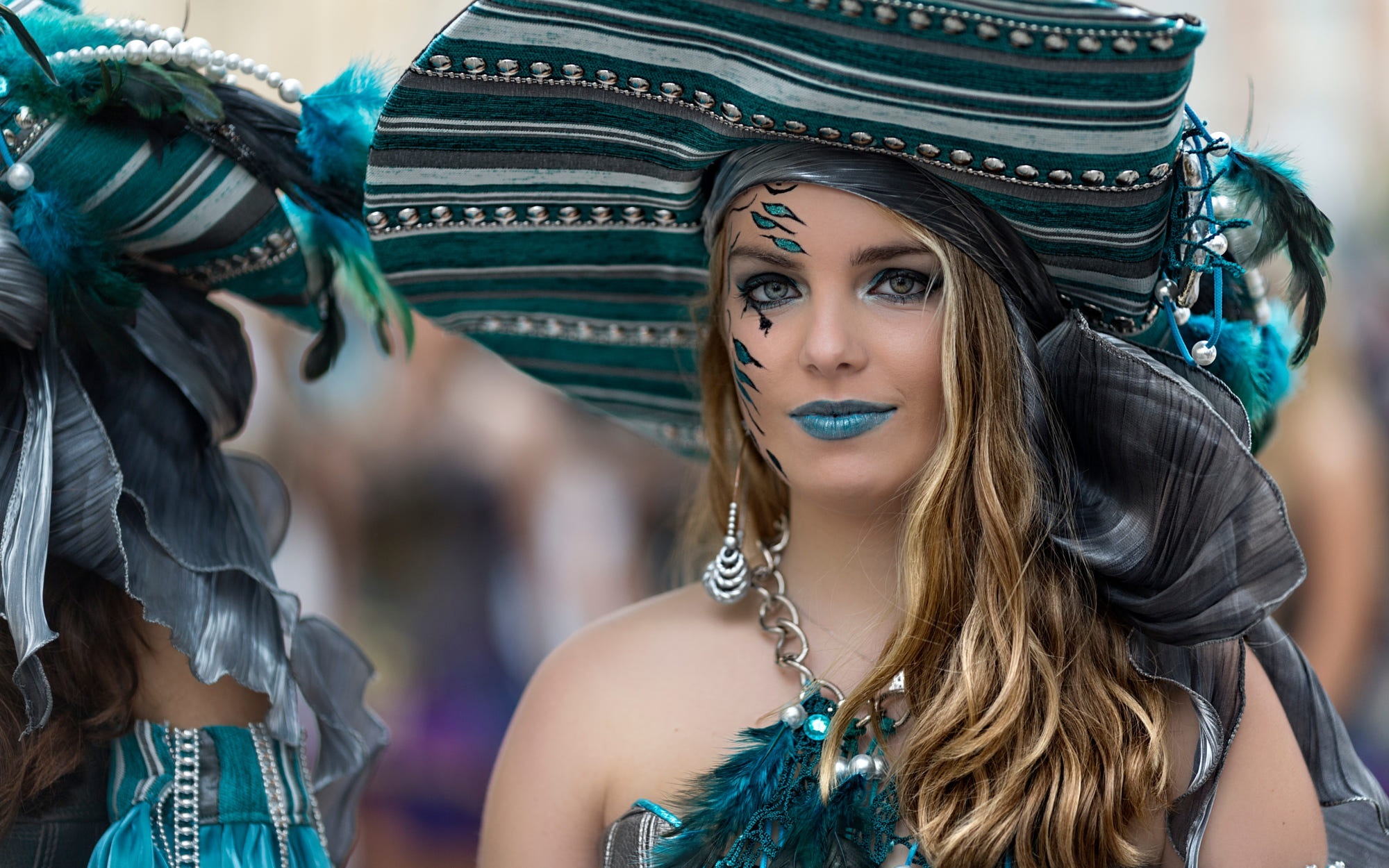 Woman in elaborate carnival costume with feathered hat HD Wallpaper