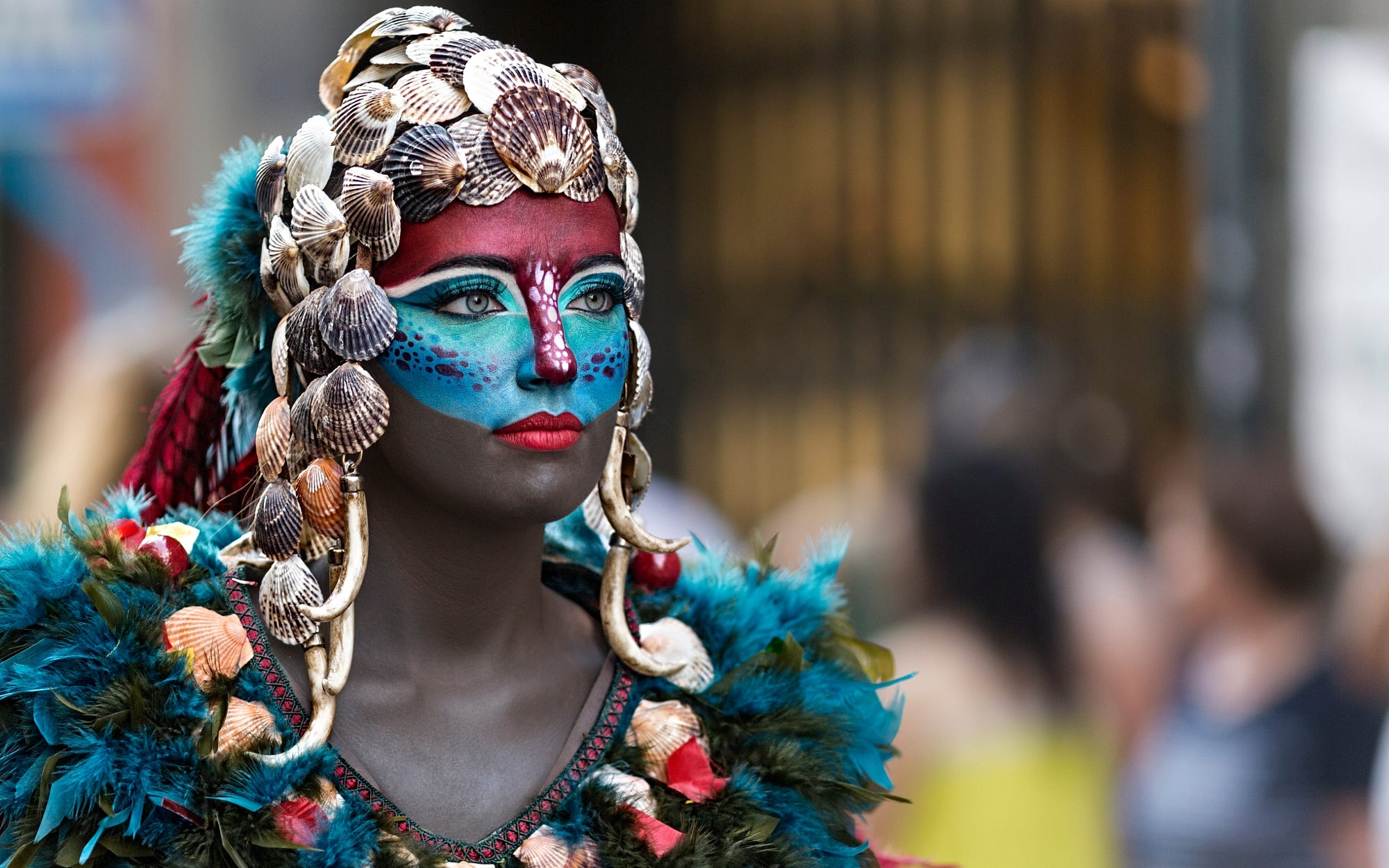 Woman in elaborate seashell costume and face paint HD Wallpaper
