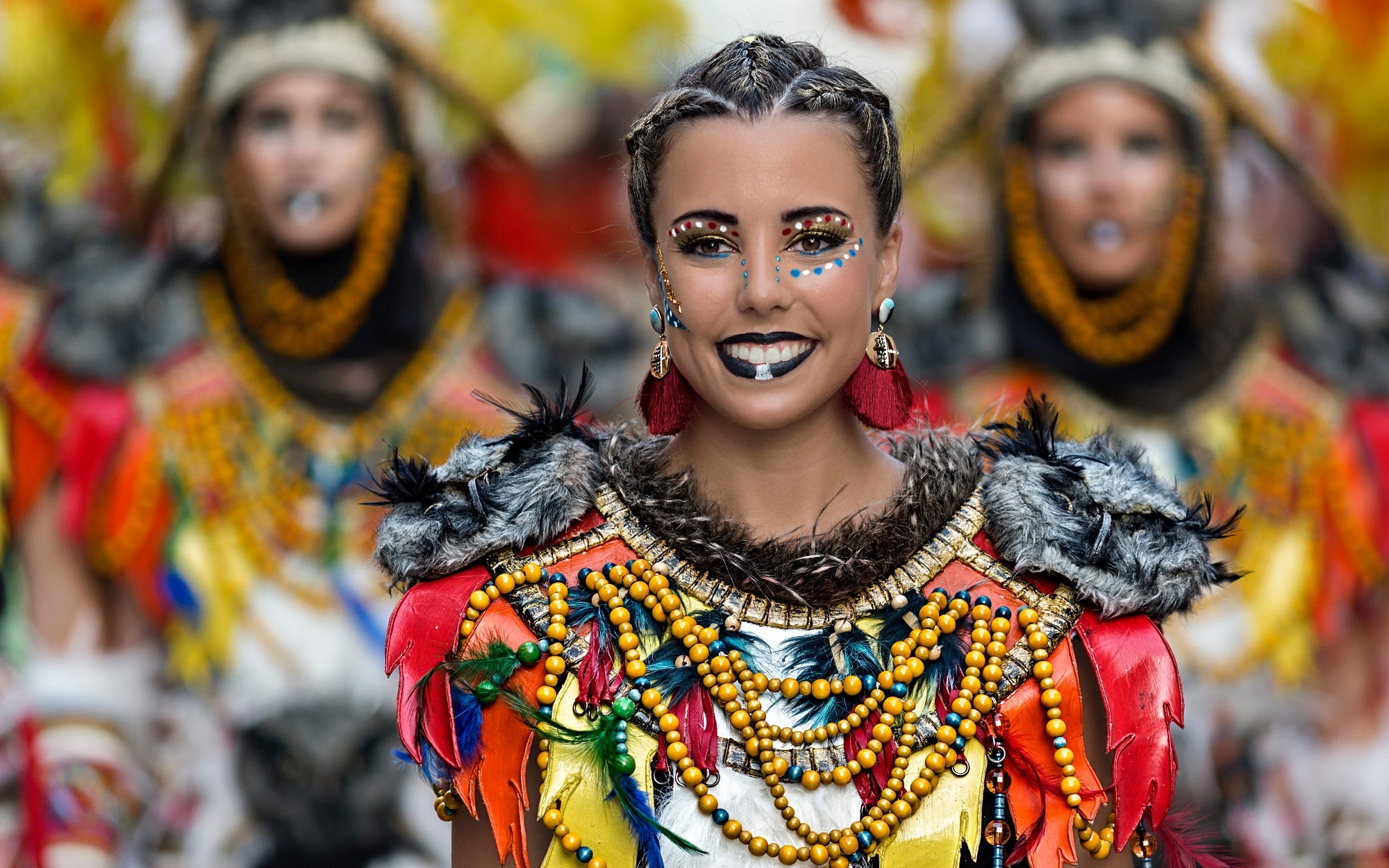 Woman in colorful carnival costume with face paint HD Wallpaper