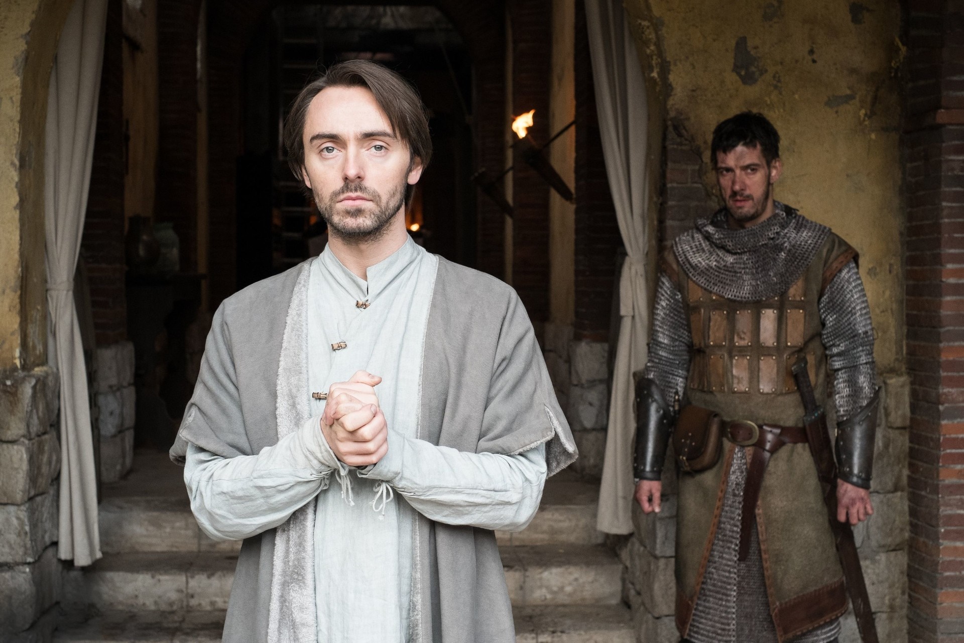Two men in historical costumes in front of a building HD Wallpaper