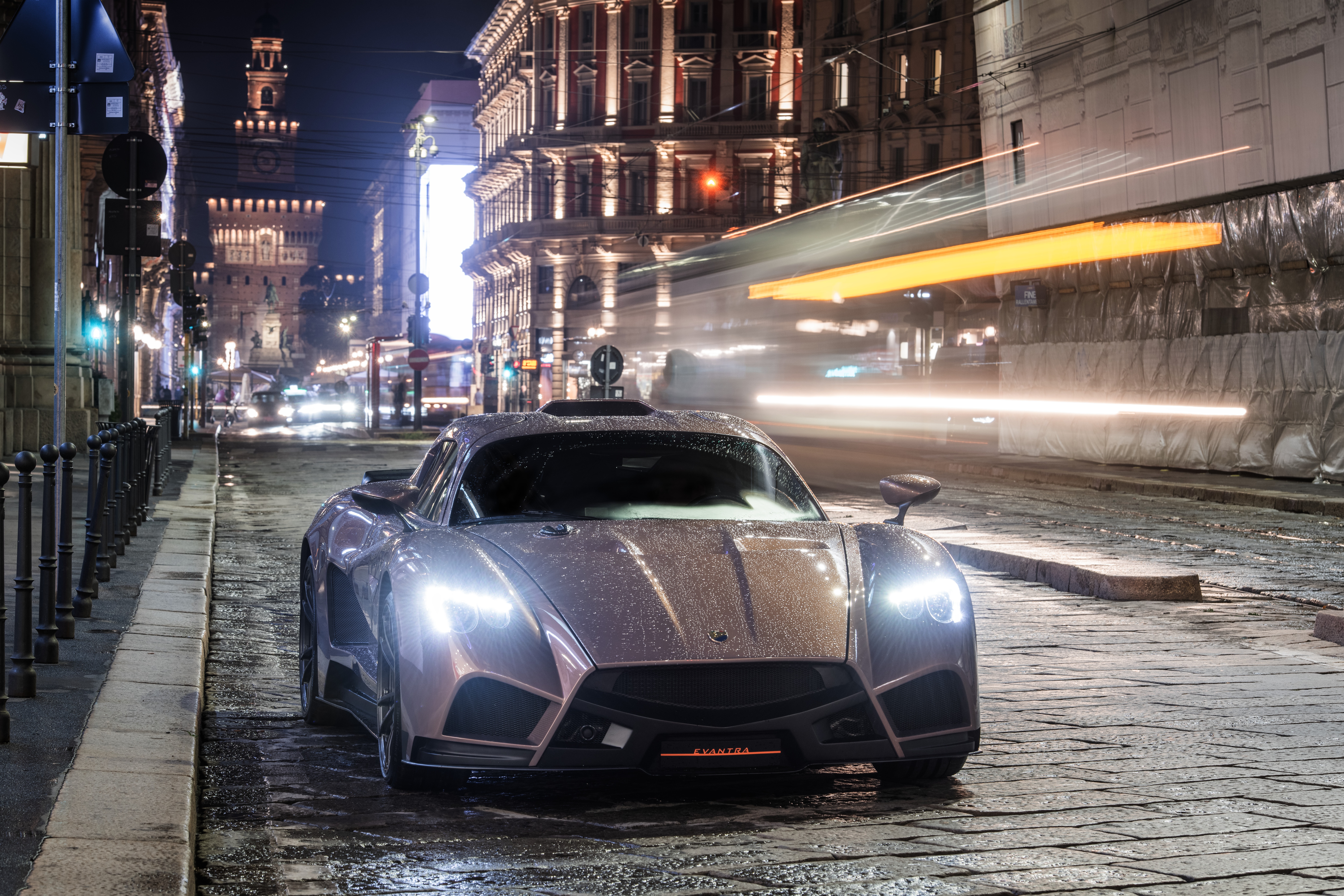 Mazzanti Evantra sports car on a wet city street at night HD Wallpaper