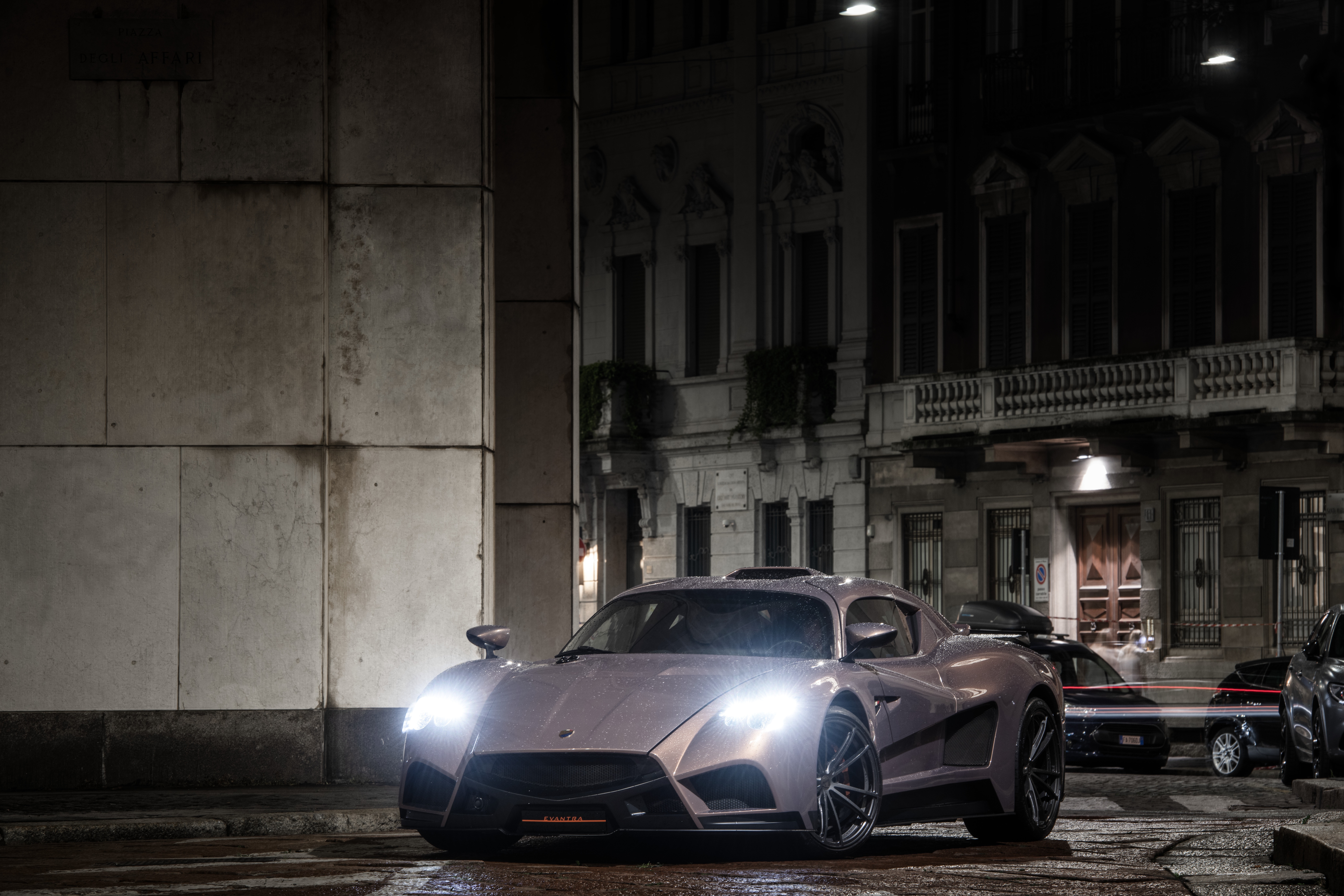 Mazzanti Evantra parked on a wet street at night HD Wallpaper