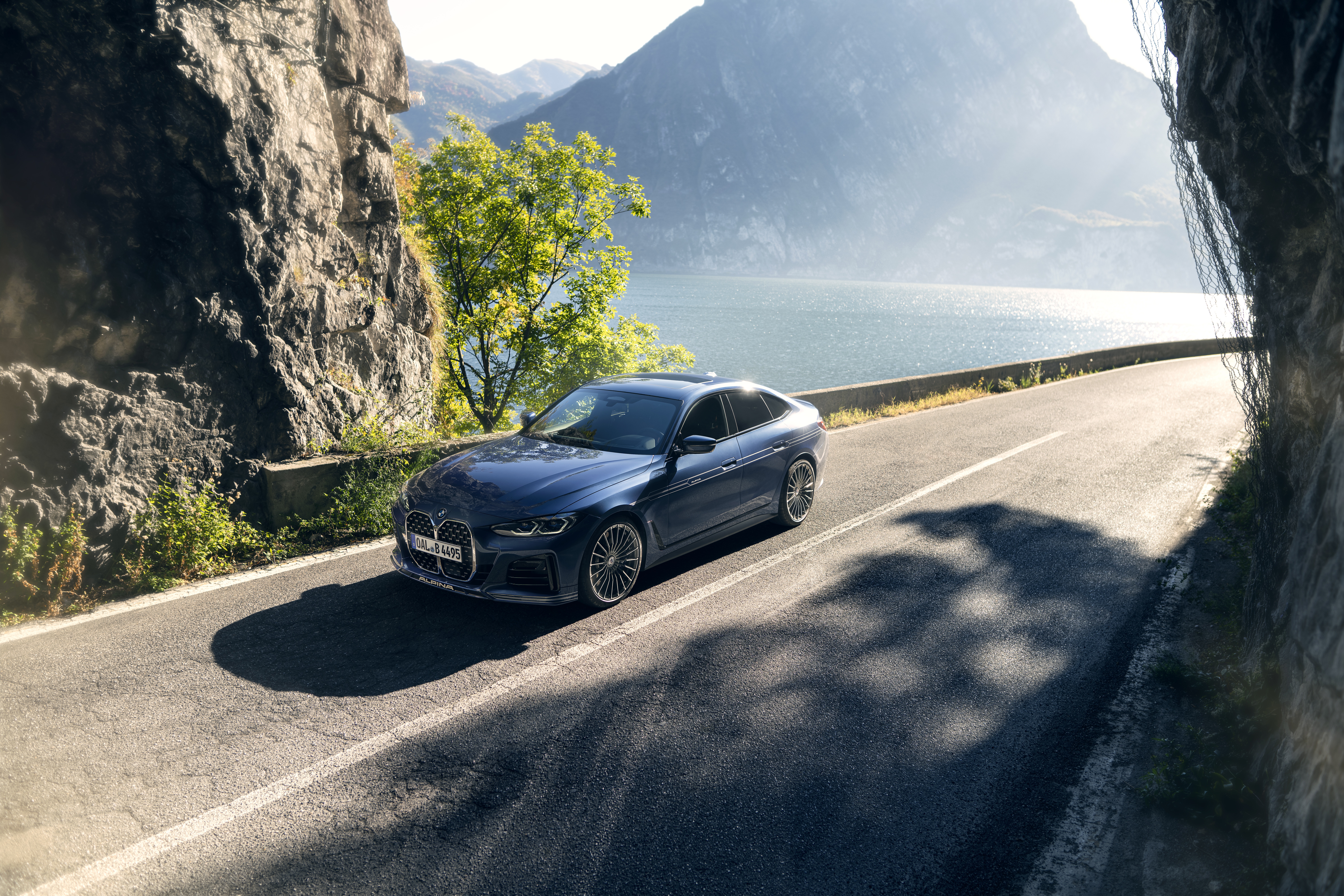 Alpina B4 Gran Coupé on a scenic road HD Wallpaper