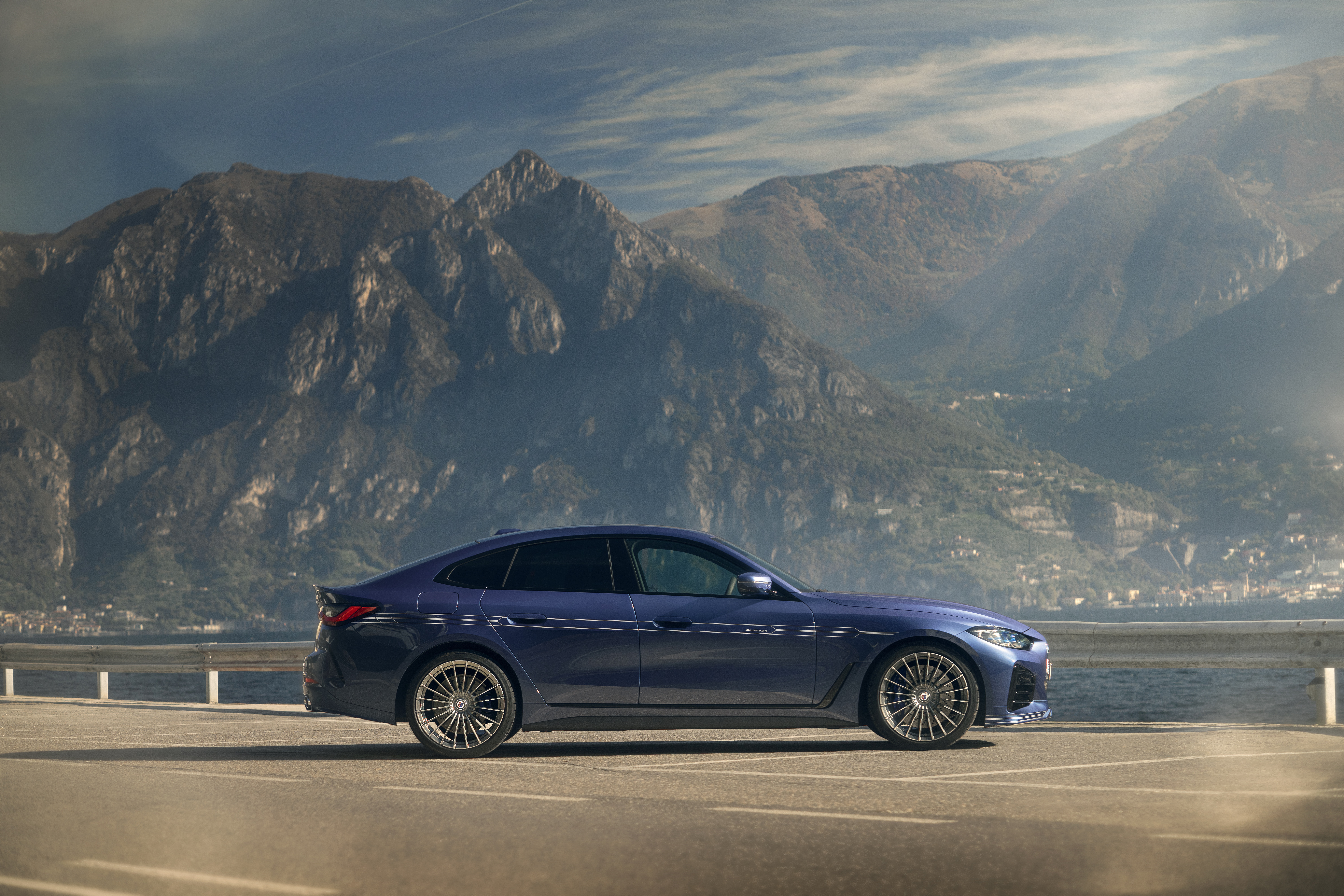 Alpina B4 Gran Coupé by a lake with mountains HD Wallpaper