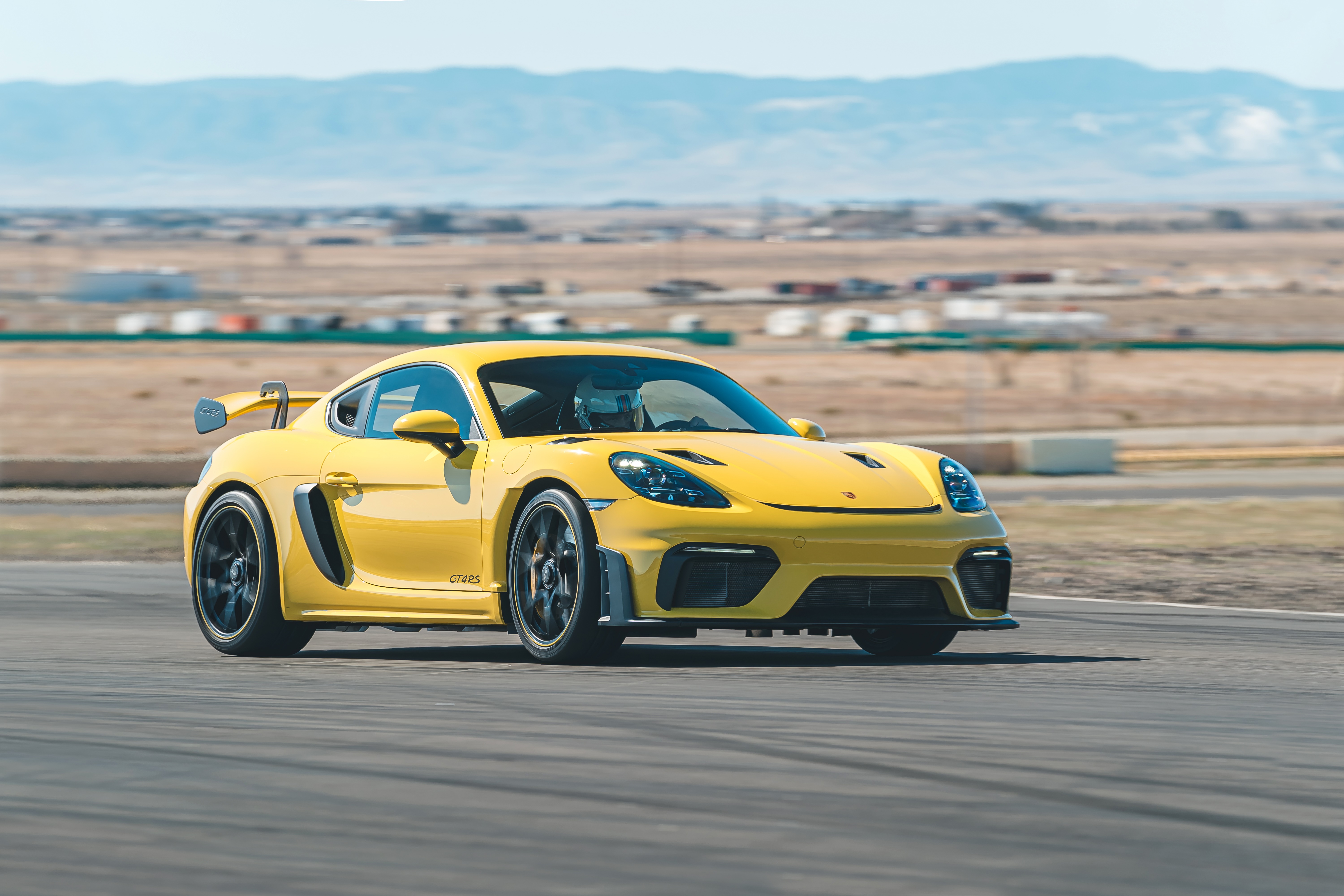 Yellow Porsche 718 Cayman GT4 RS on a Racetrack 4K HD Wallpaper