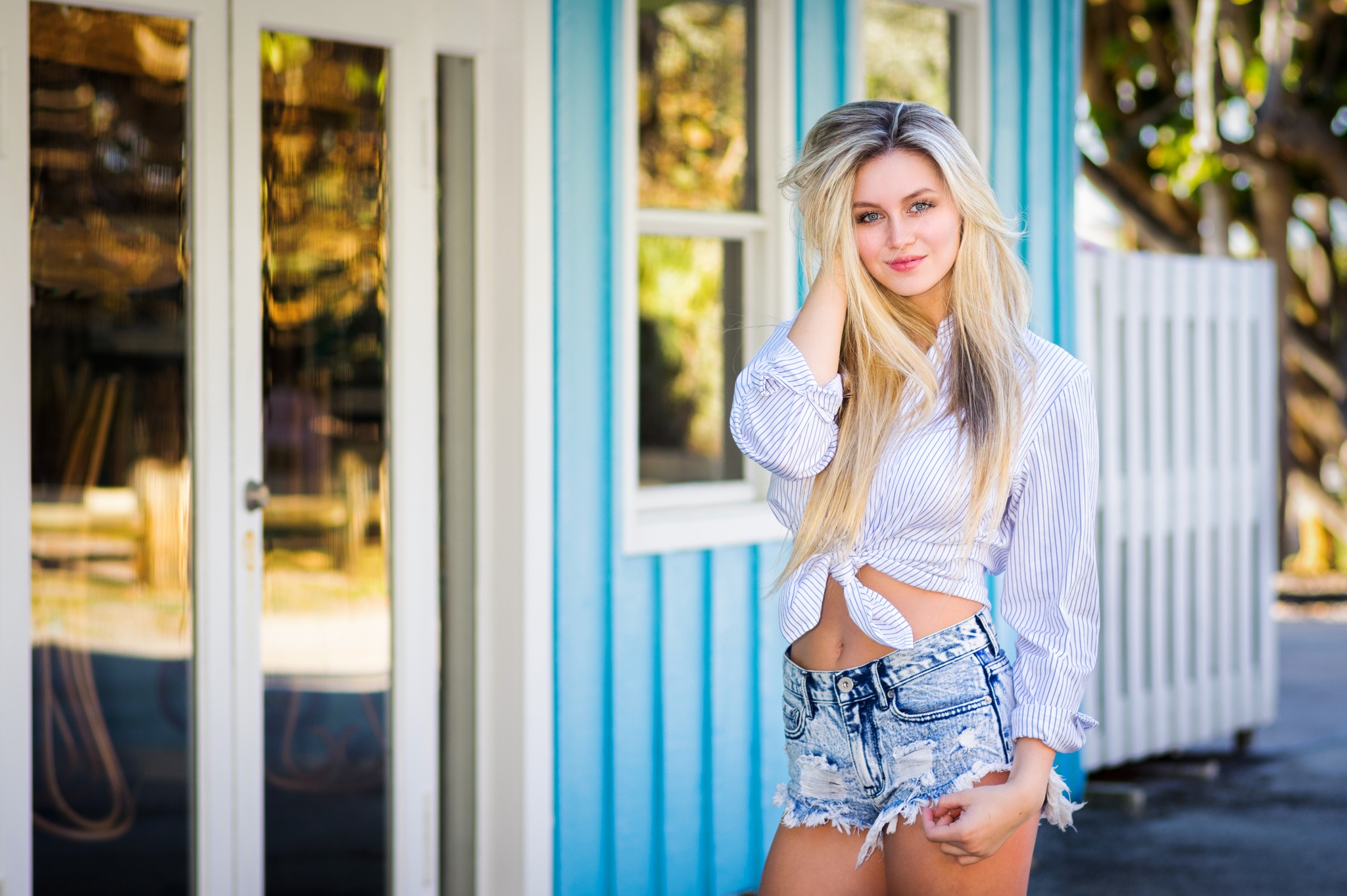 Woman in striped shirt and denim shorts HD Wallpaper