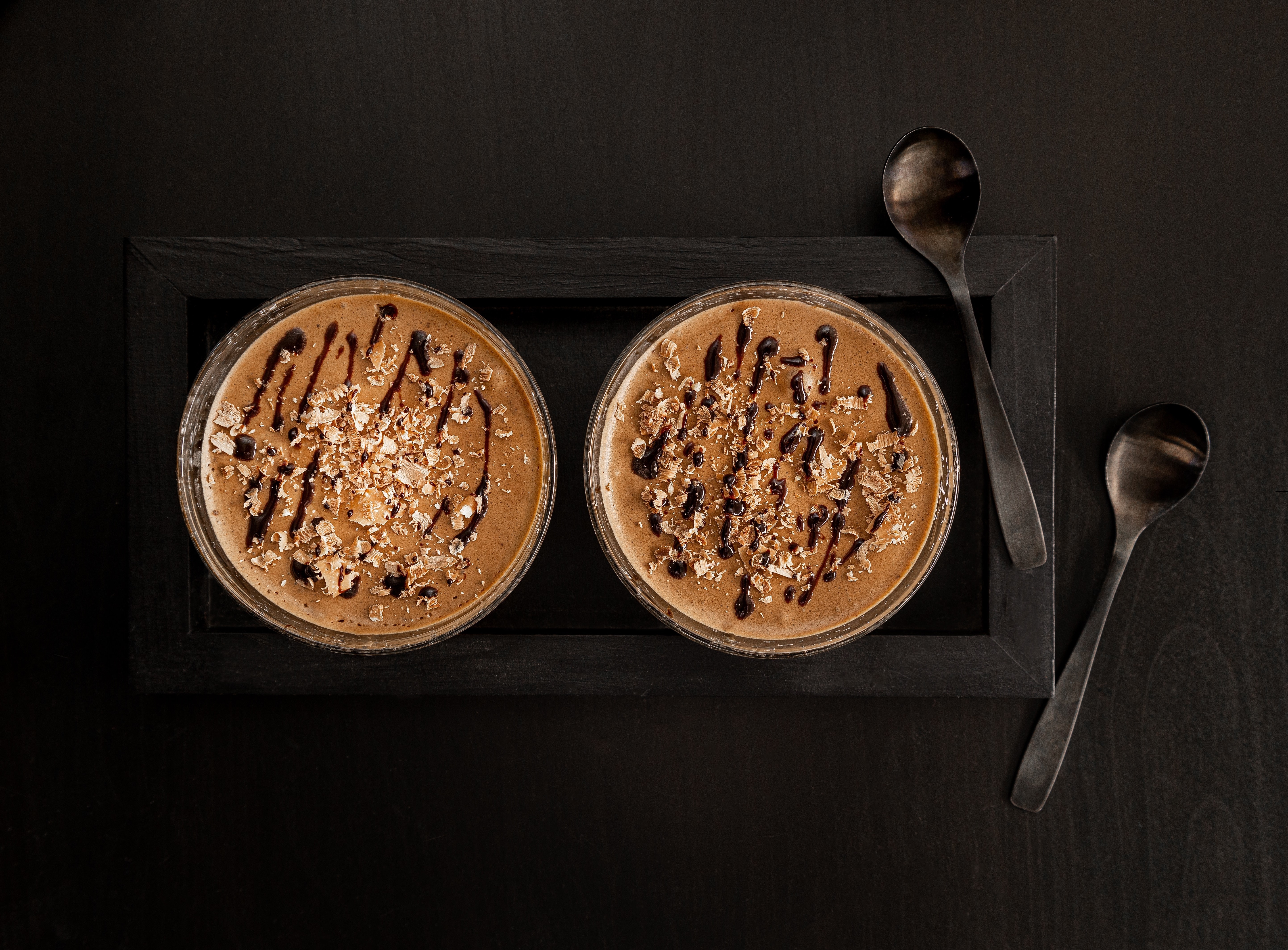 Two coffee mousses with chocolate drizzle and nuts HD Wallpaper