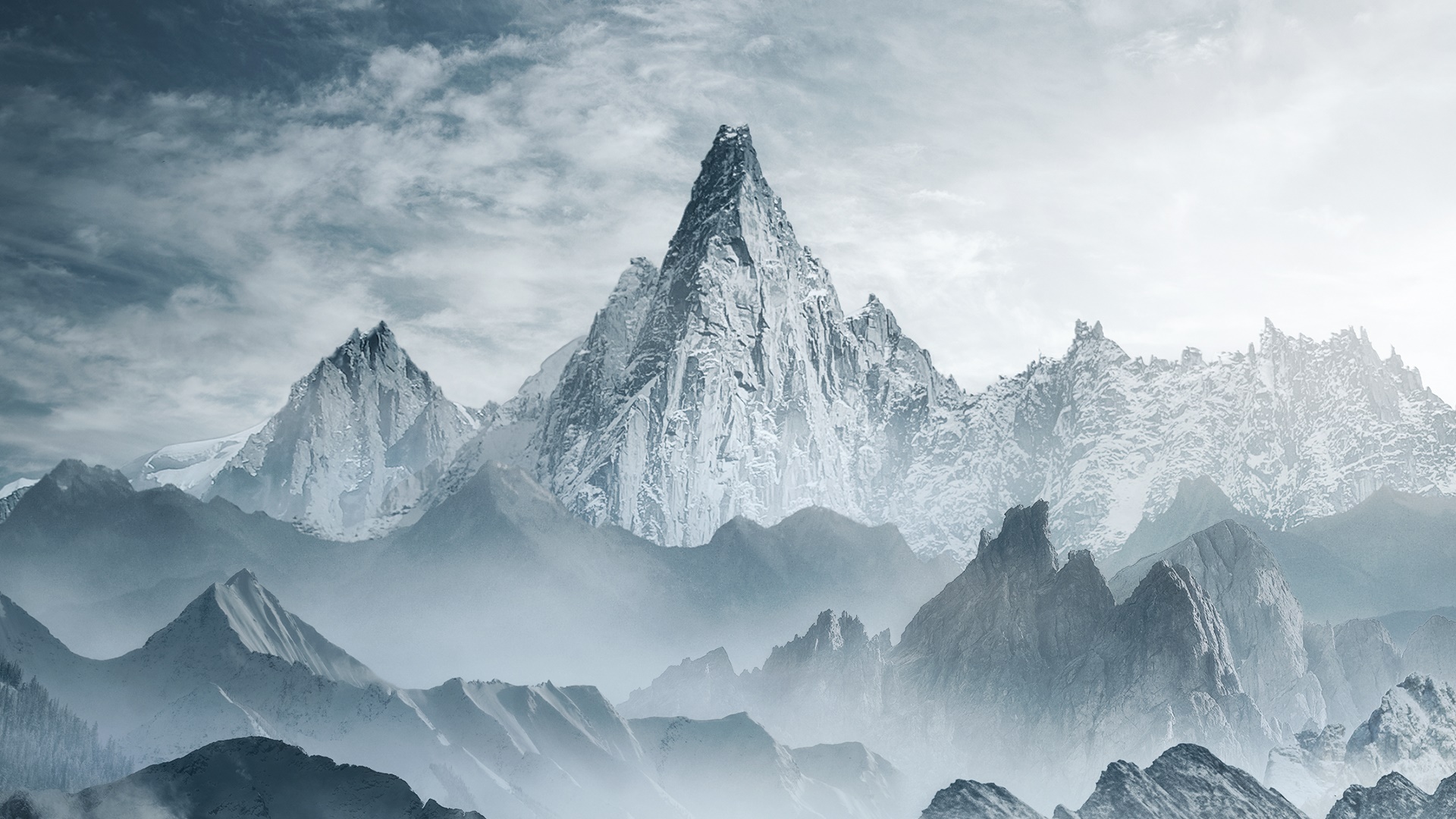 Snow-covered mountains under a cloudy sky HD Wallpaper