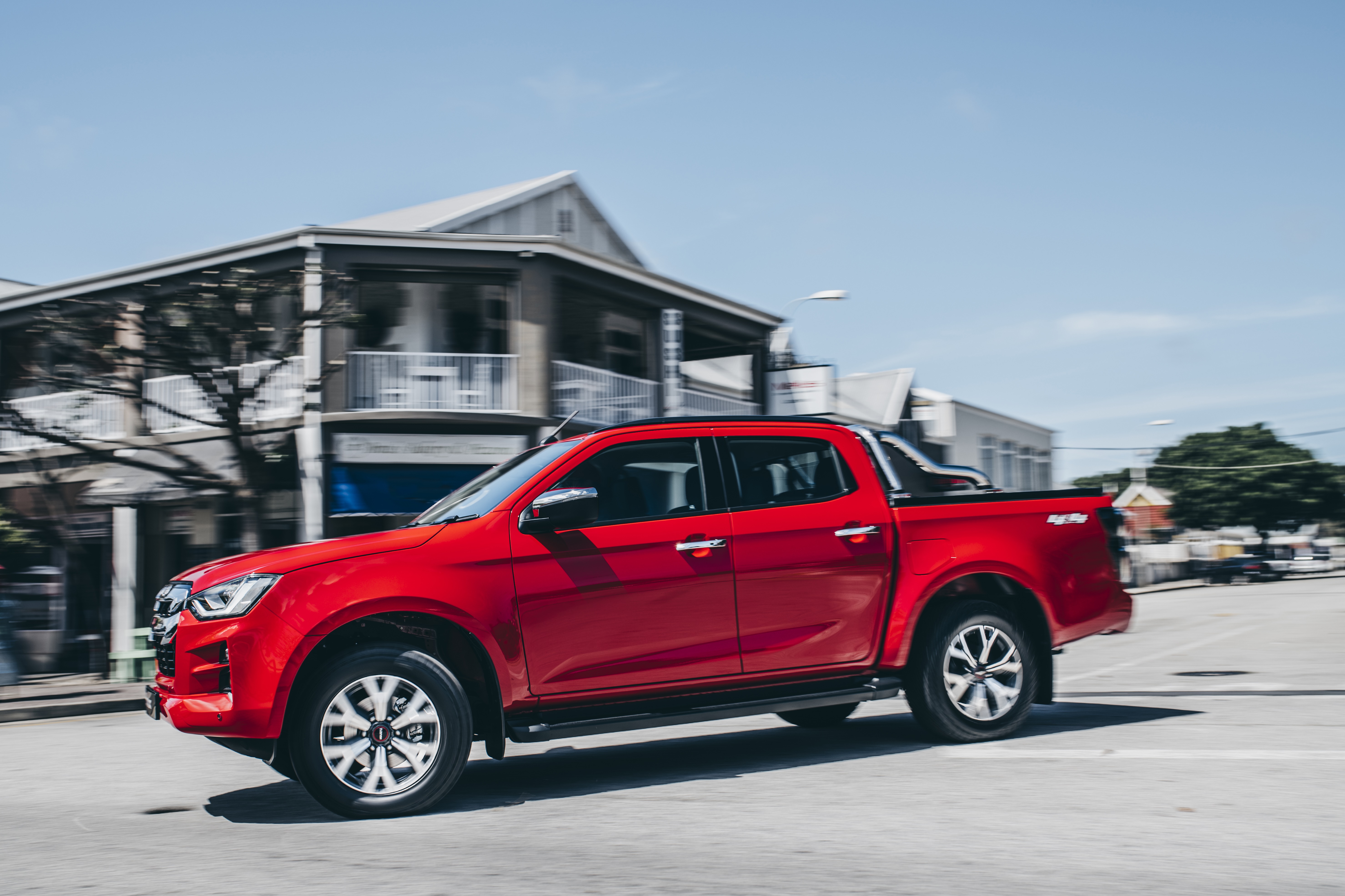 Red Isuzu D-Max 4K Pickup Truck Driving on Street HD Wallpaper