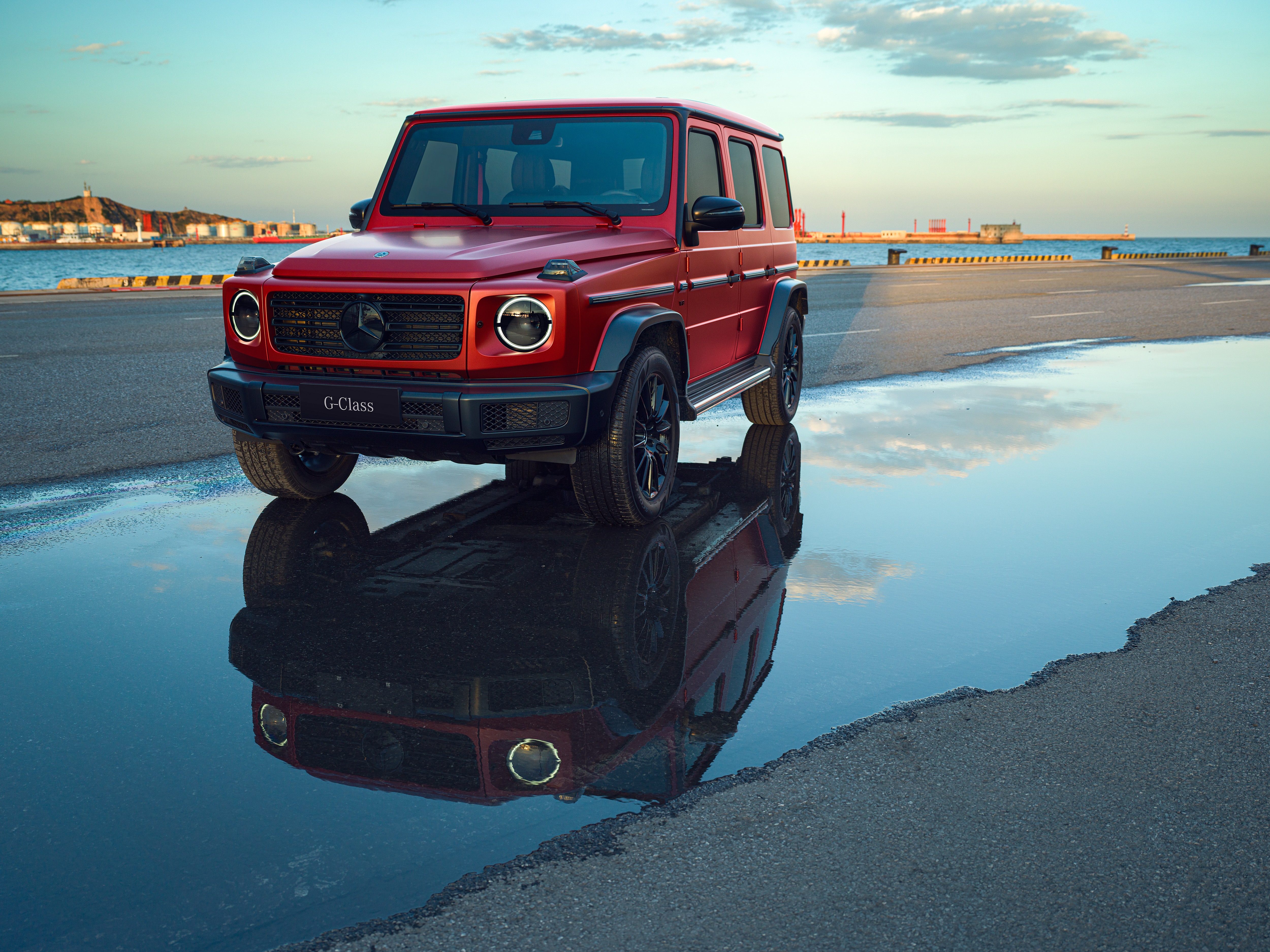 Red Mercedes-Benz G-Class parked by the water HD Wallpaper