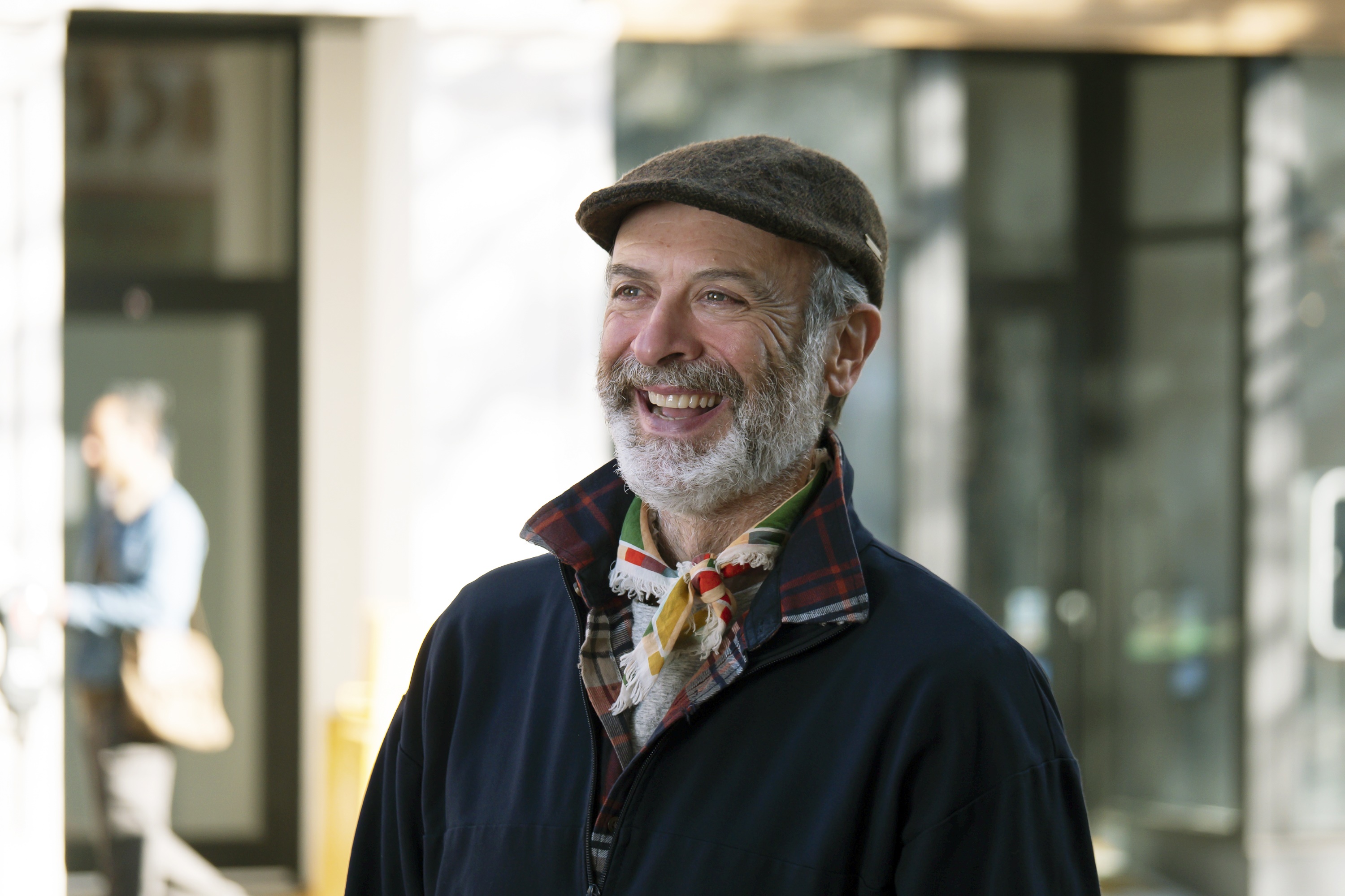 Man wearing a flat cap and scarf HD Wallpaper
