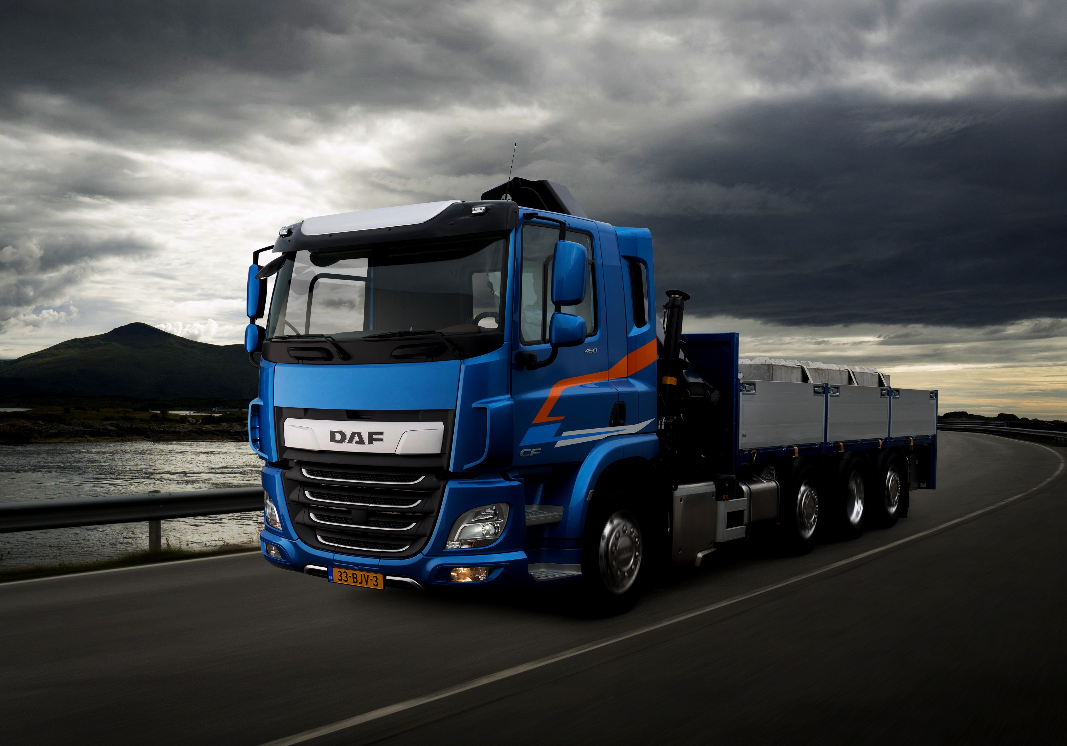 Blue DAF CF truck driving on a road HD Wallpaper