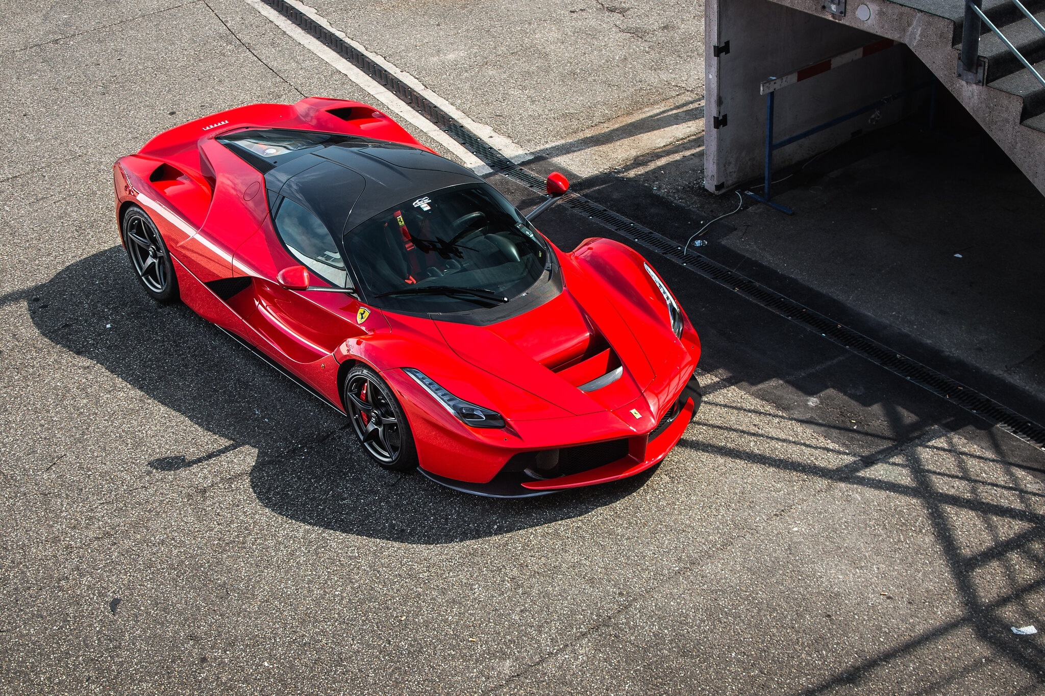 Red Ferrari LaFerrari parked on asphalt HD Wallpaper