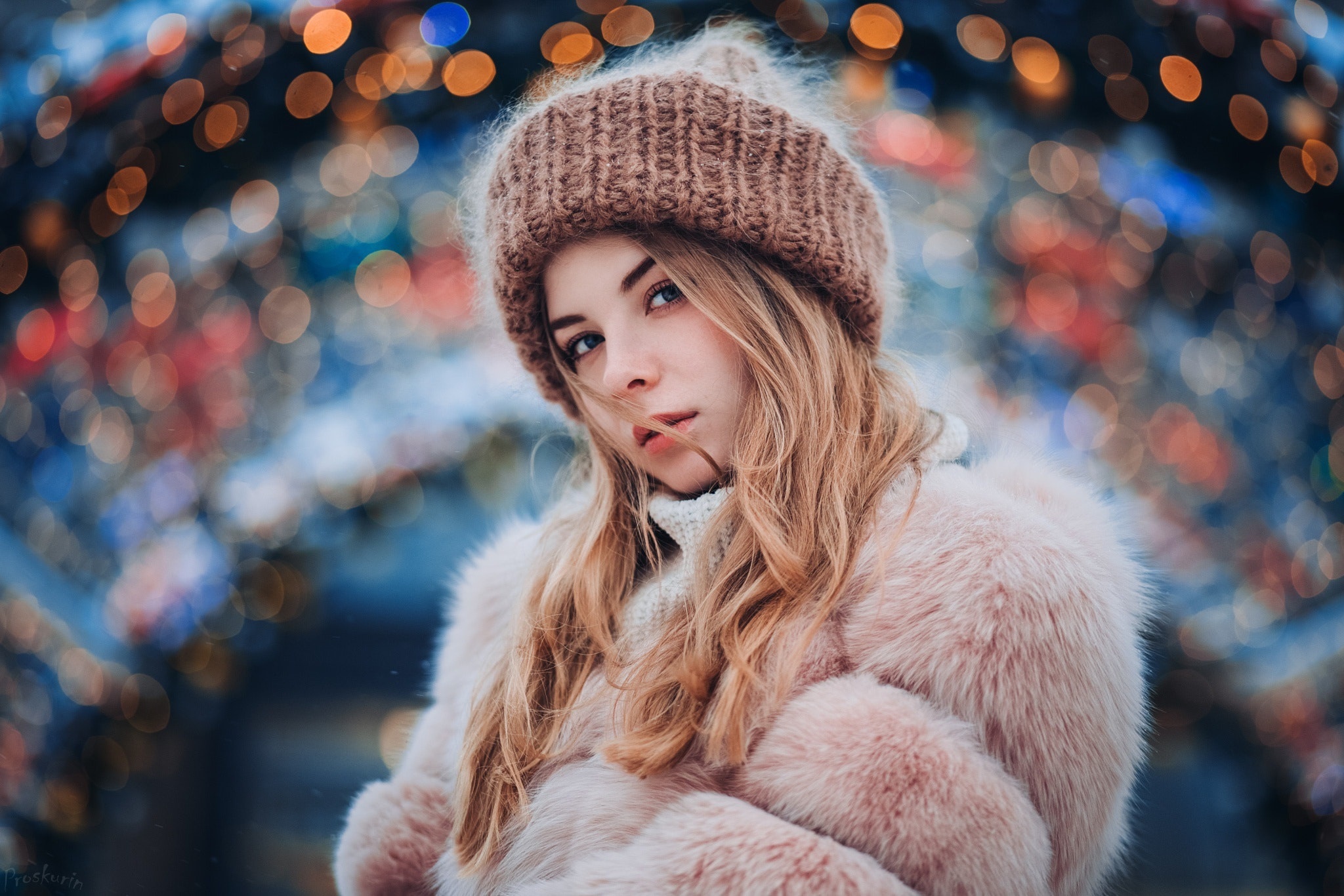Young woman in winter clothing with bokeh lights HD Wallpaper