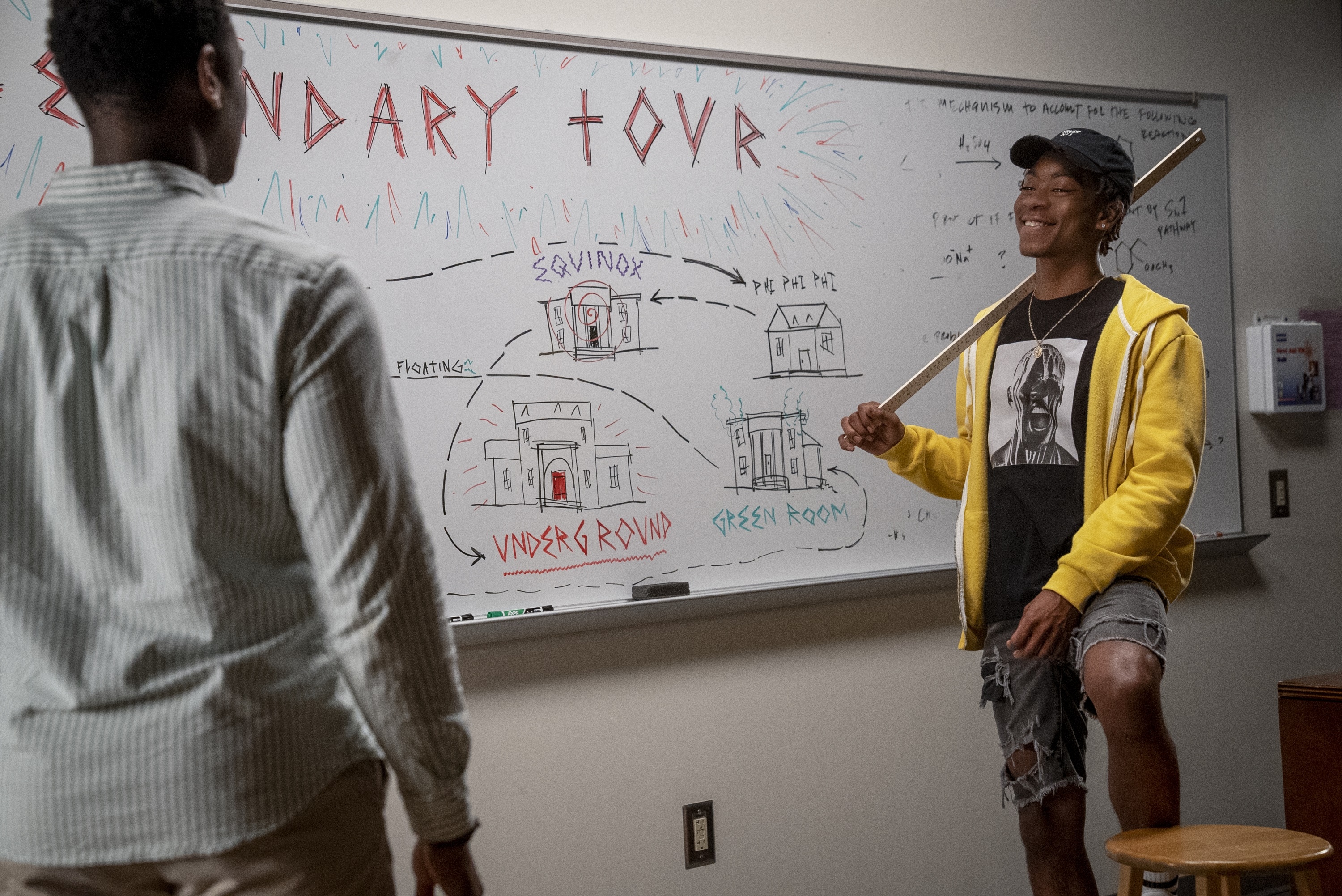 Two men in front of a whiteboard with a diagram HD Wallpaper