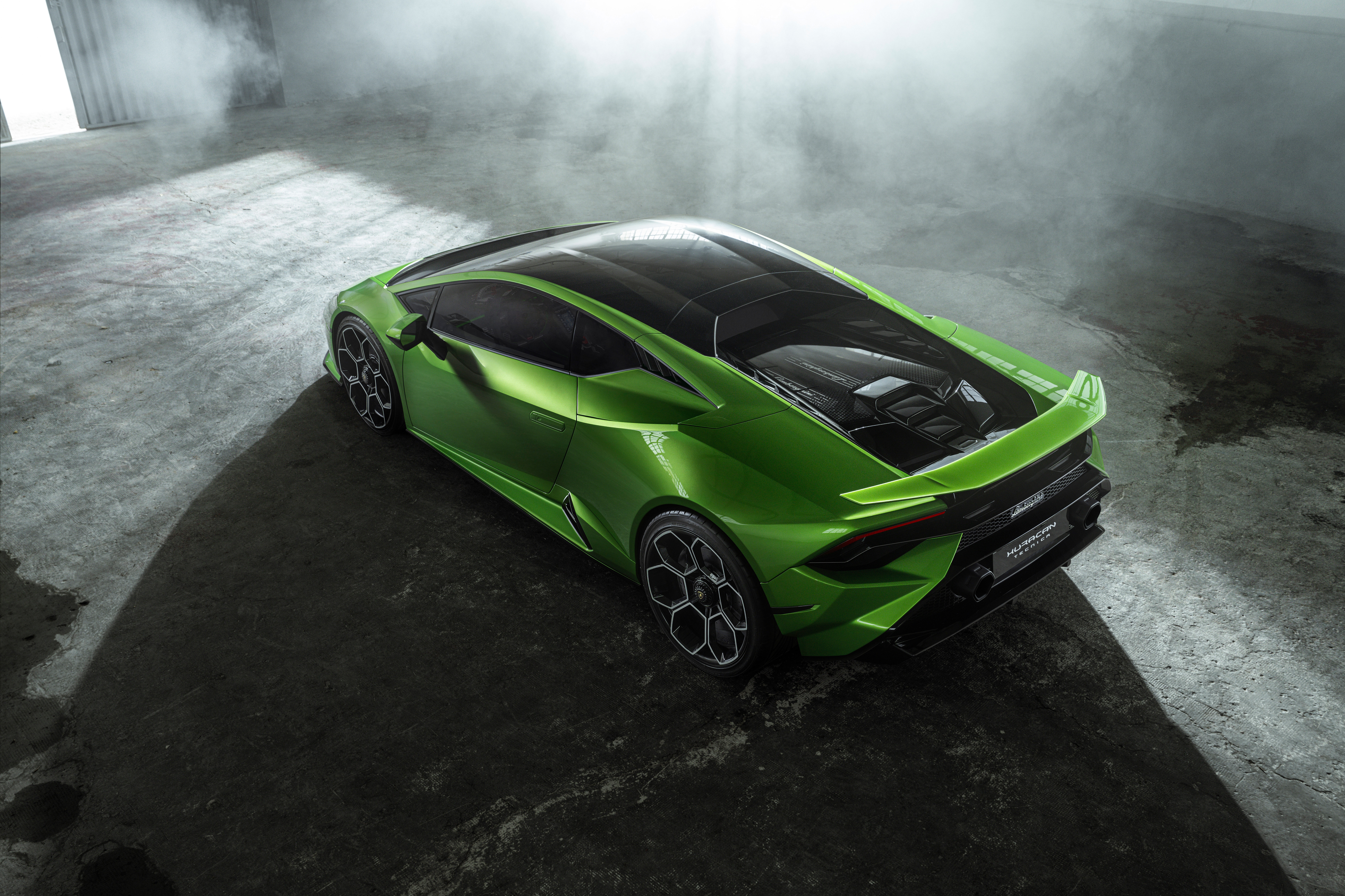 Green Lamborghini Huracán Tecnica in a smoky garage HD Wallpaper