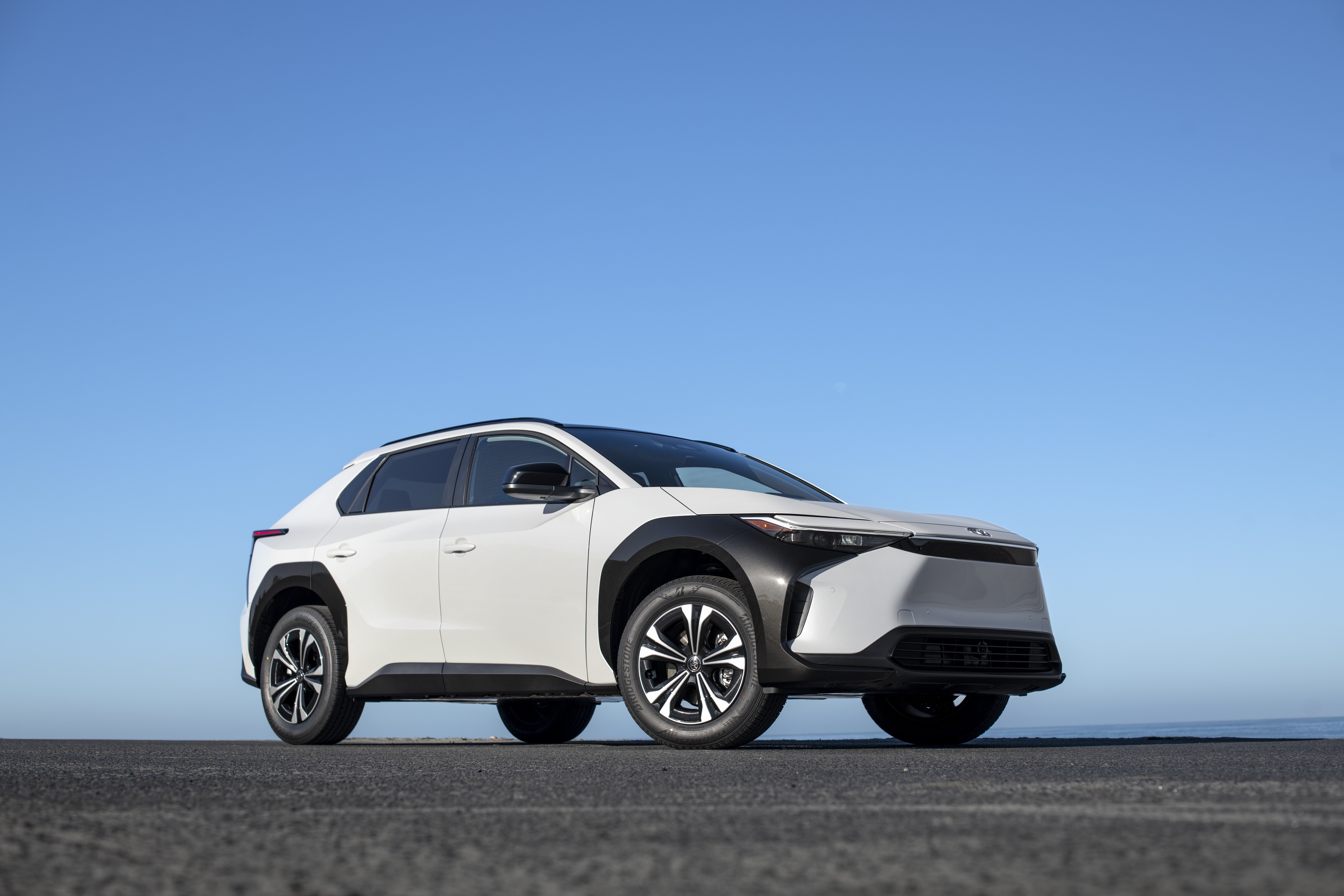 White Toyota BZ4X electric SUV parked outdoors HD Wallpaper