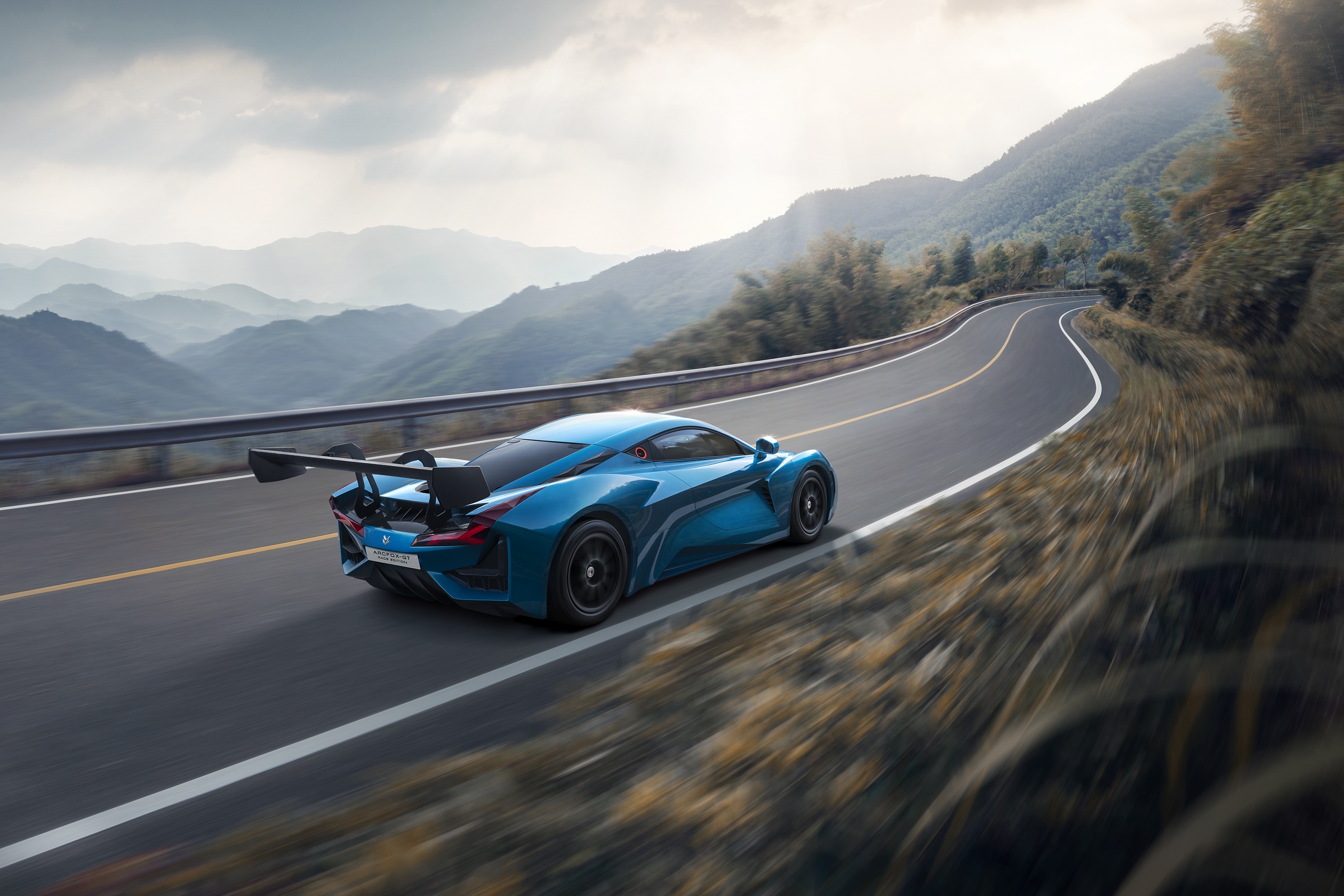 Arcfox-GT electric supercar on a mountain road HD Wallpaper
