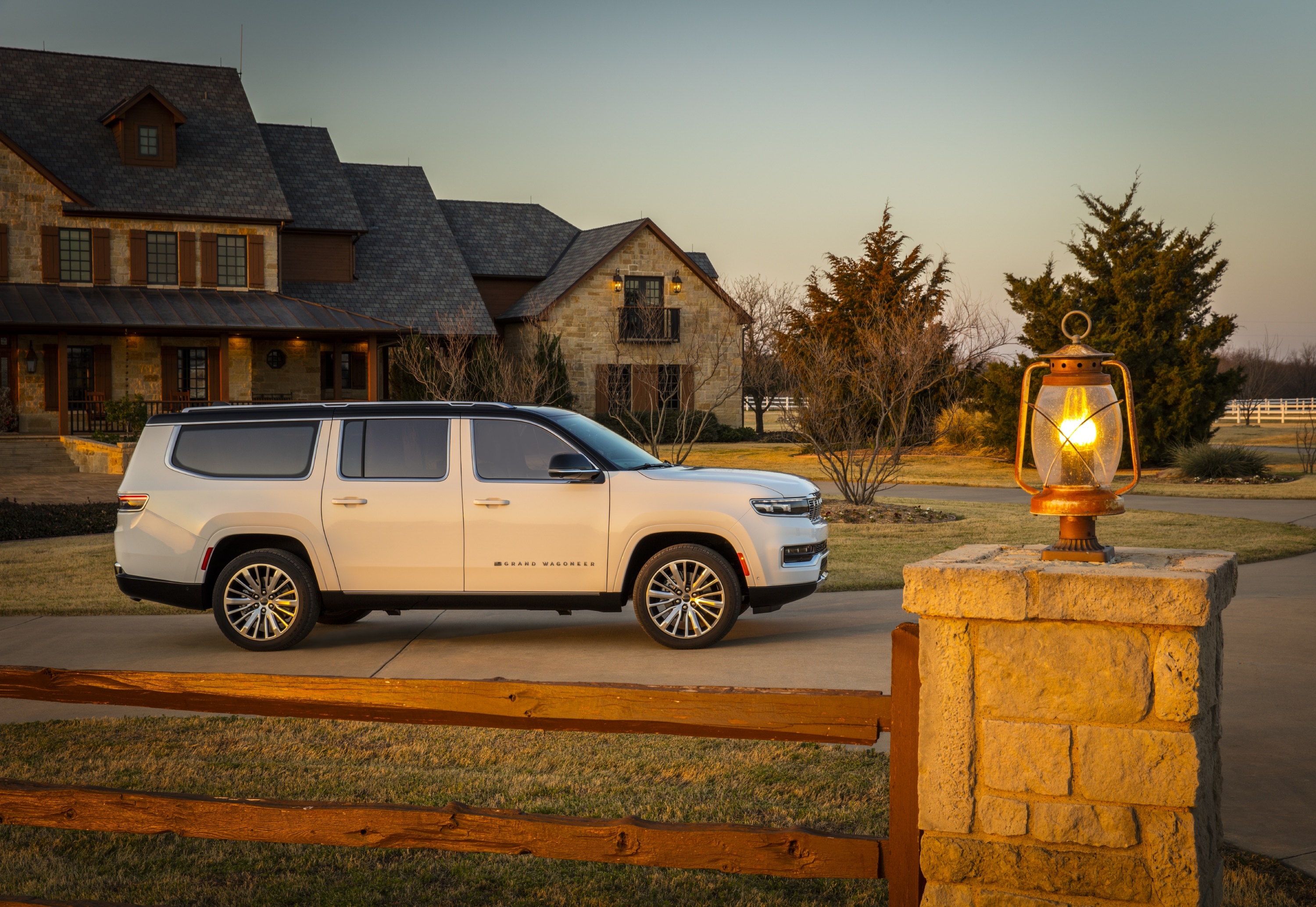 White Jeep Grand Wagoneer parked in front of a house HD Wallpaper