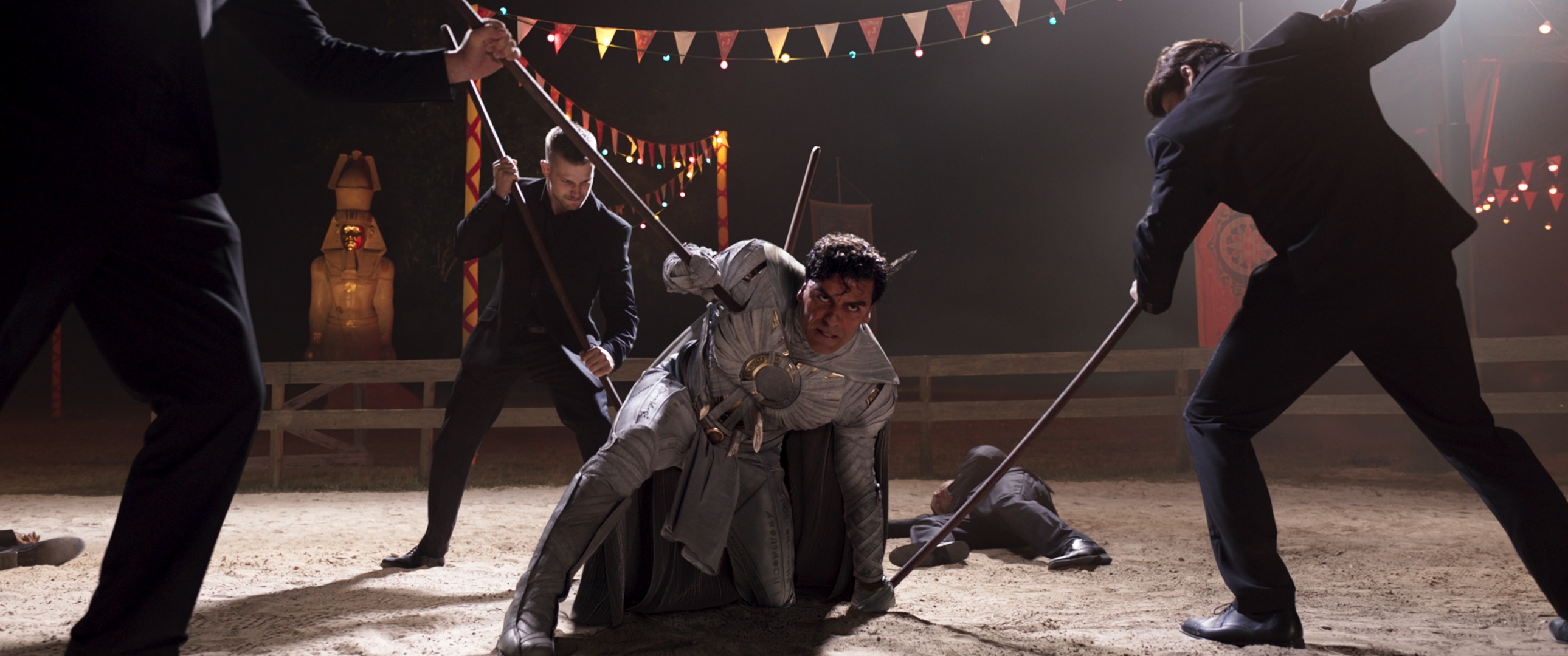 Moon Knight fighting men with staffs HD Wallpaper
