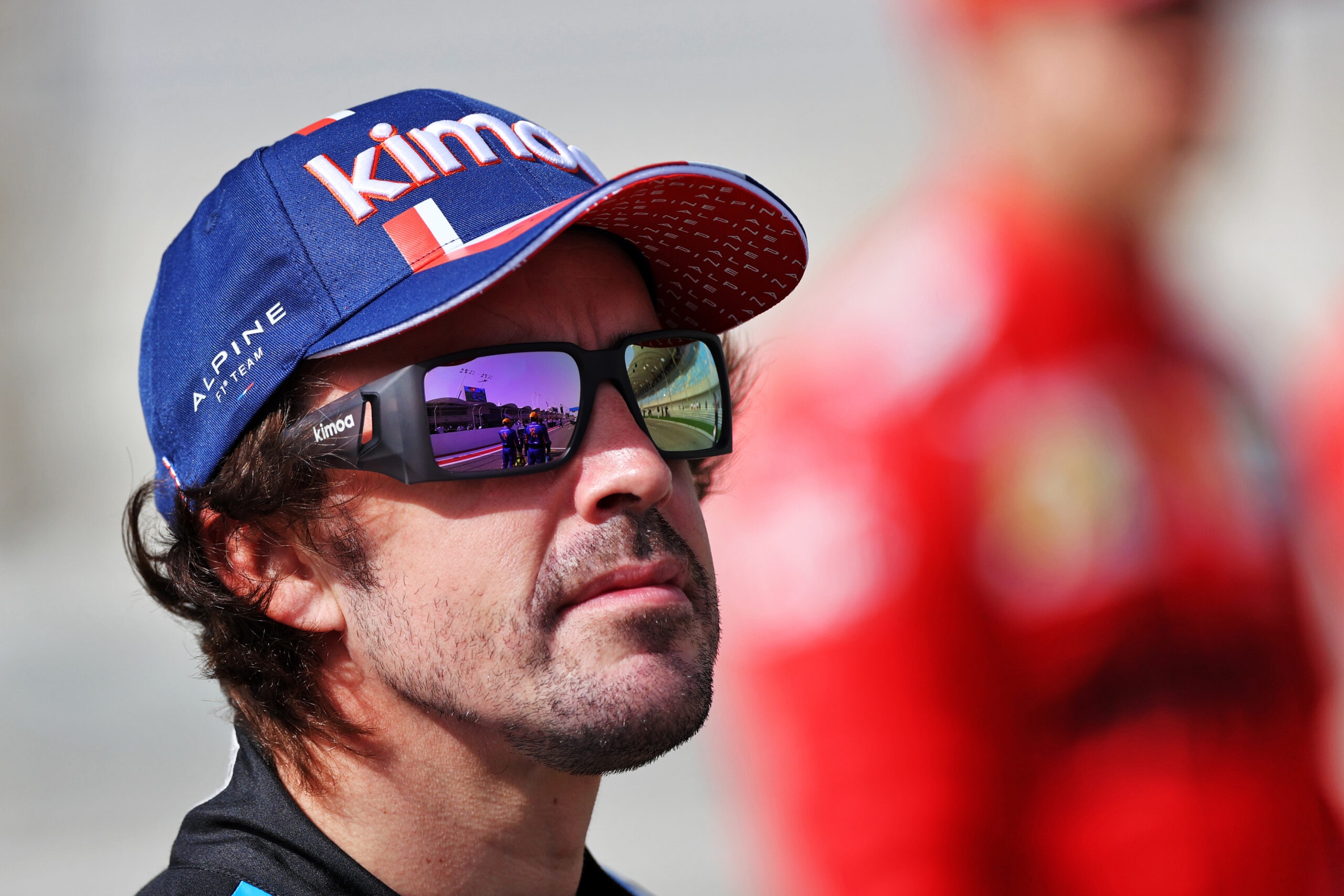 Fernando Alonso wearing Alpine F1 Team cap and Kimoa sunglasses HD Wallpaper