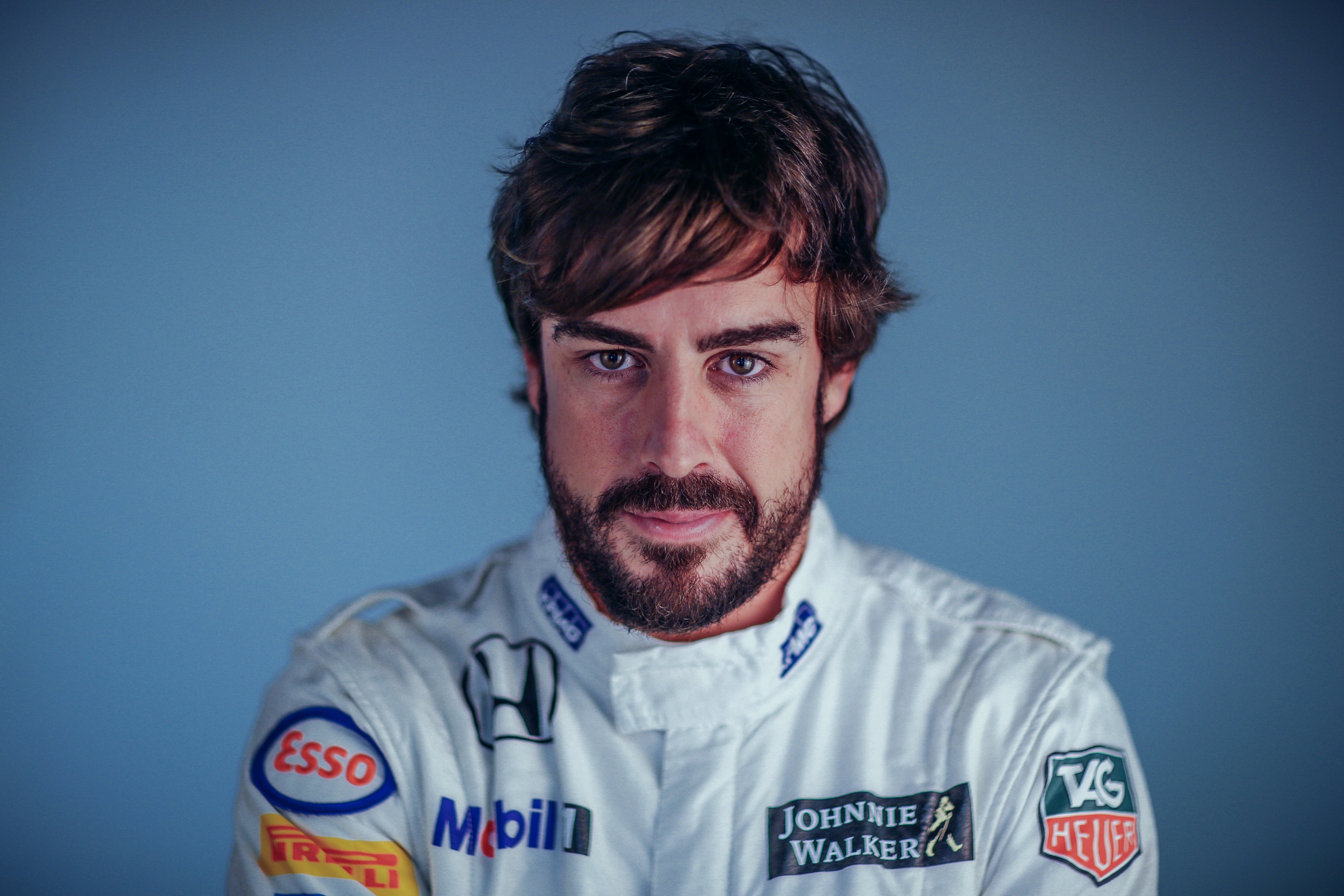 Fernando Alonso in racing suit HD Wallpaper