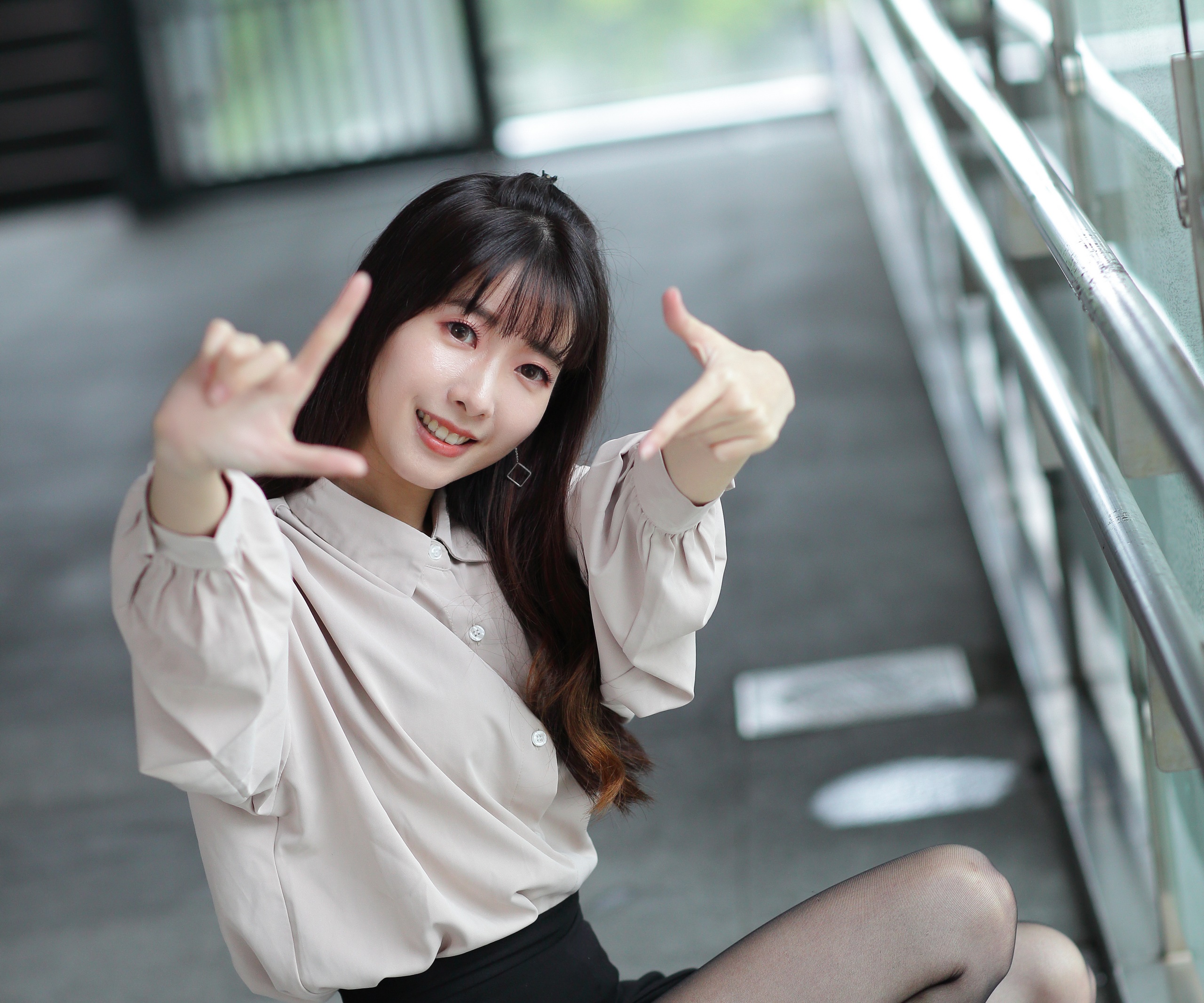 Asian woman making a frame with her hands HD Wallpaper