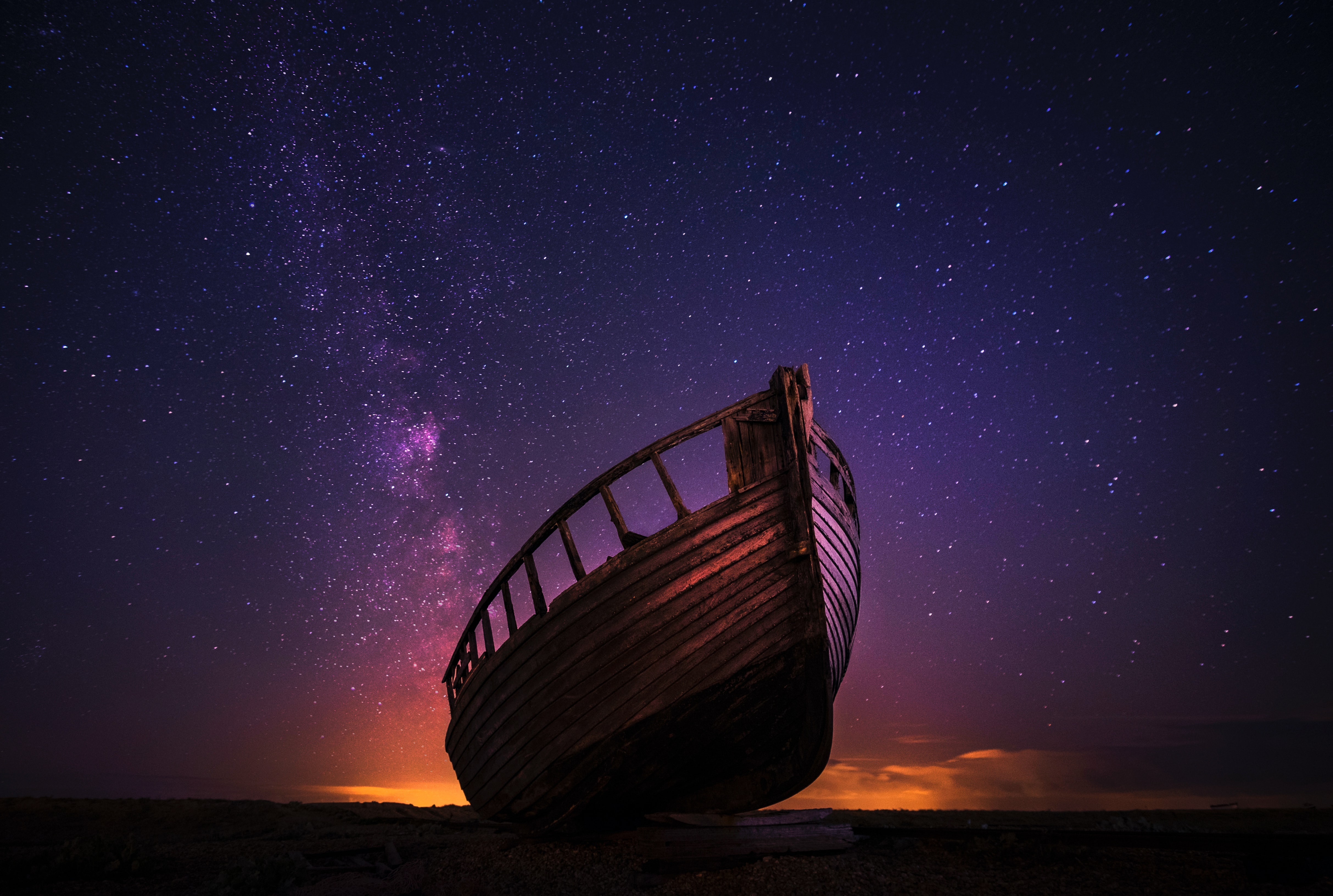 Wrecked boat under starry sky 4K HD Wallpaper