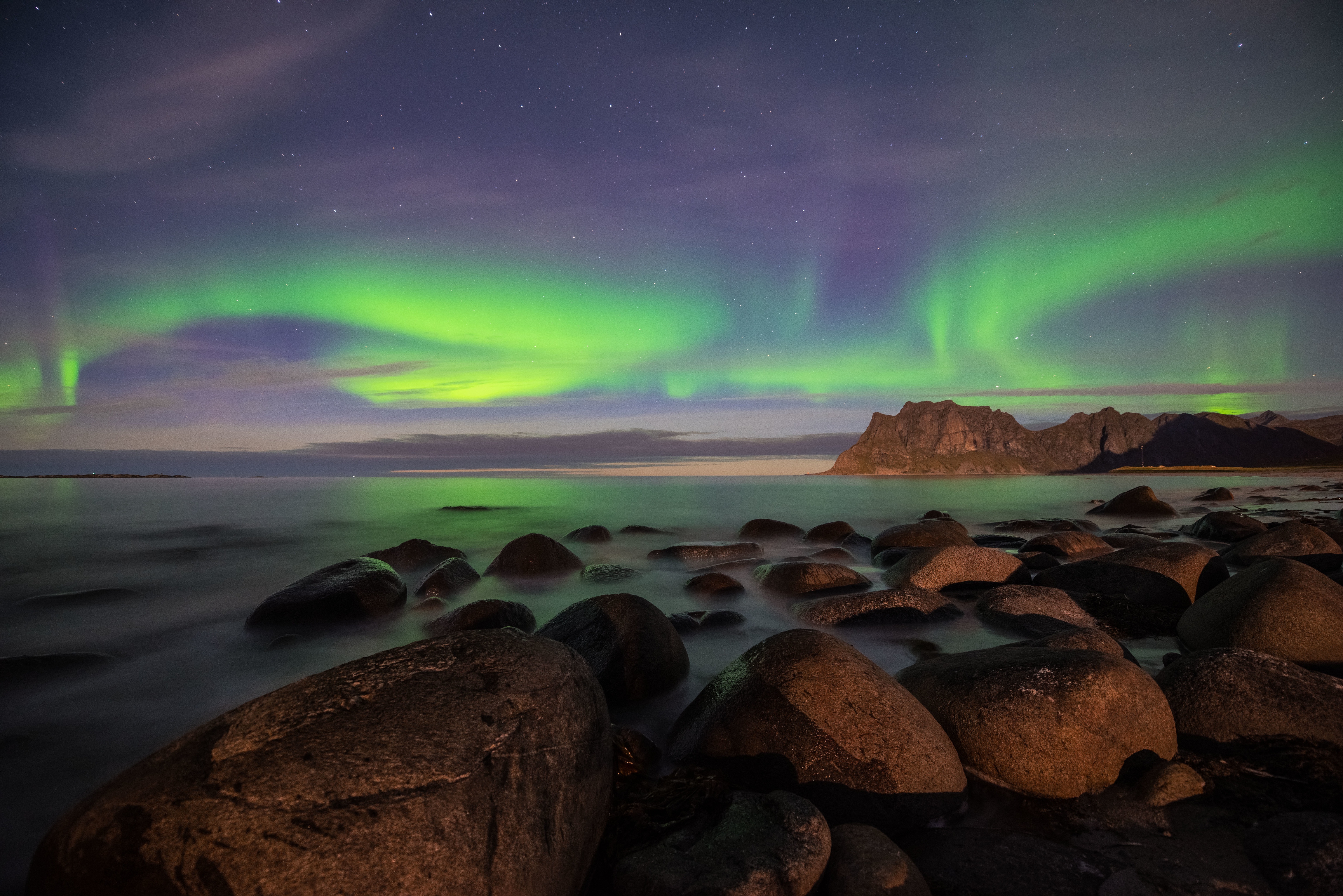 Aurora Borealis over rocky beach 4K HD Wallpaper