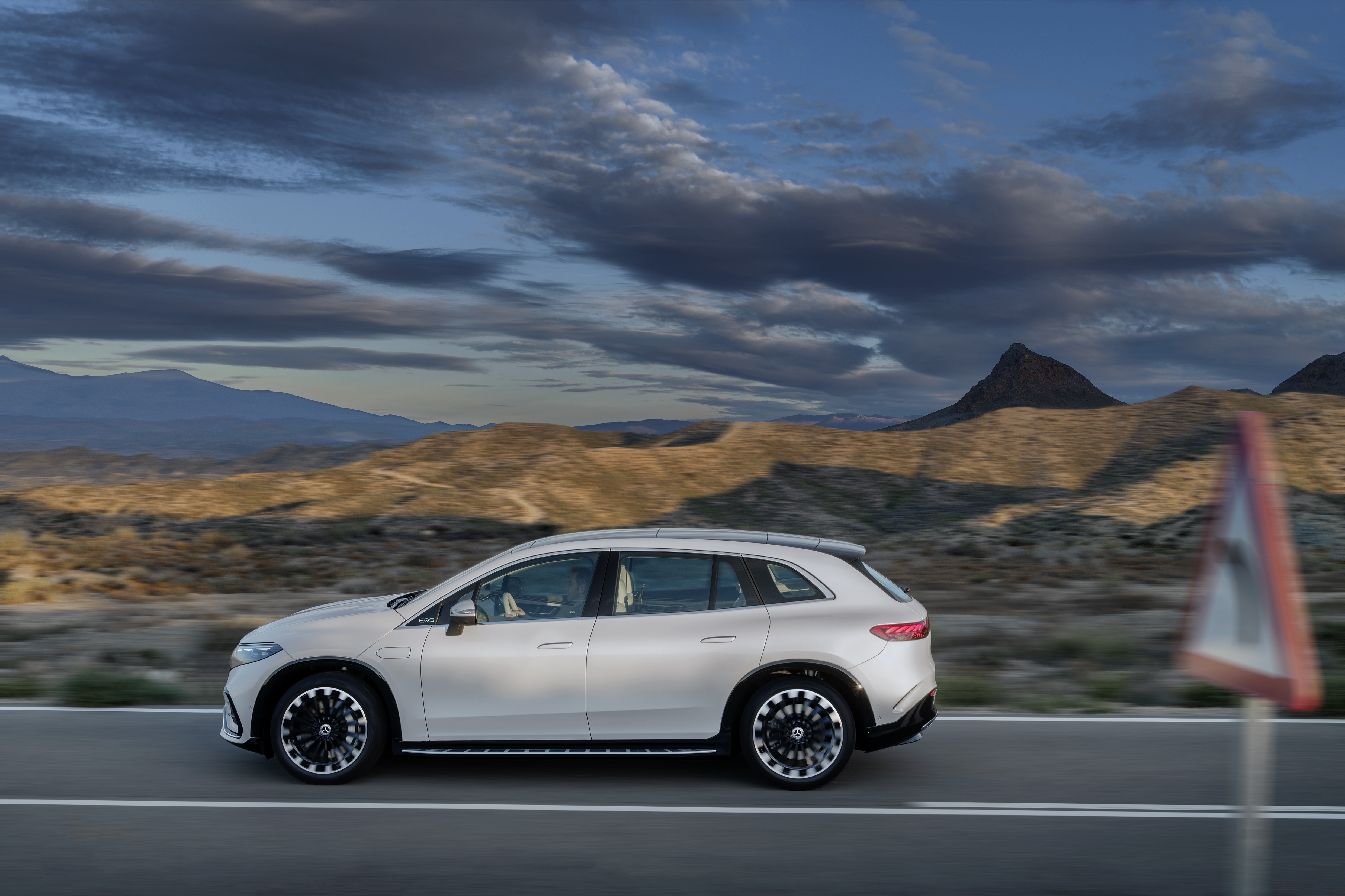 Mercedes-Benz EQS 450+ 4K SUV driving on a road HD Wallpaper