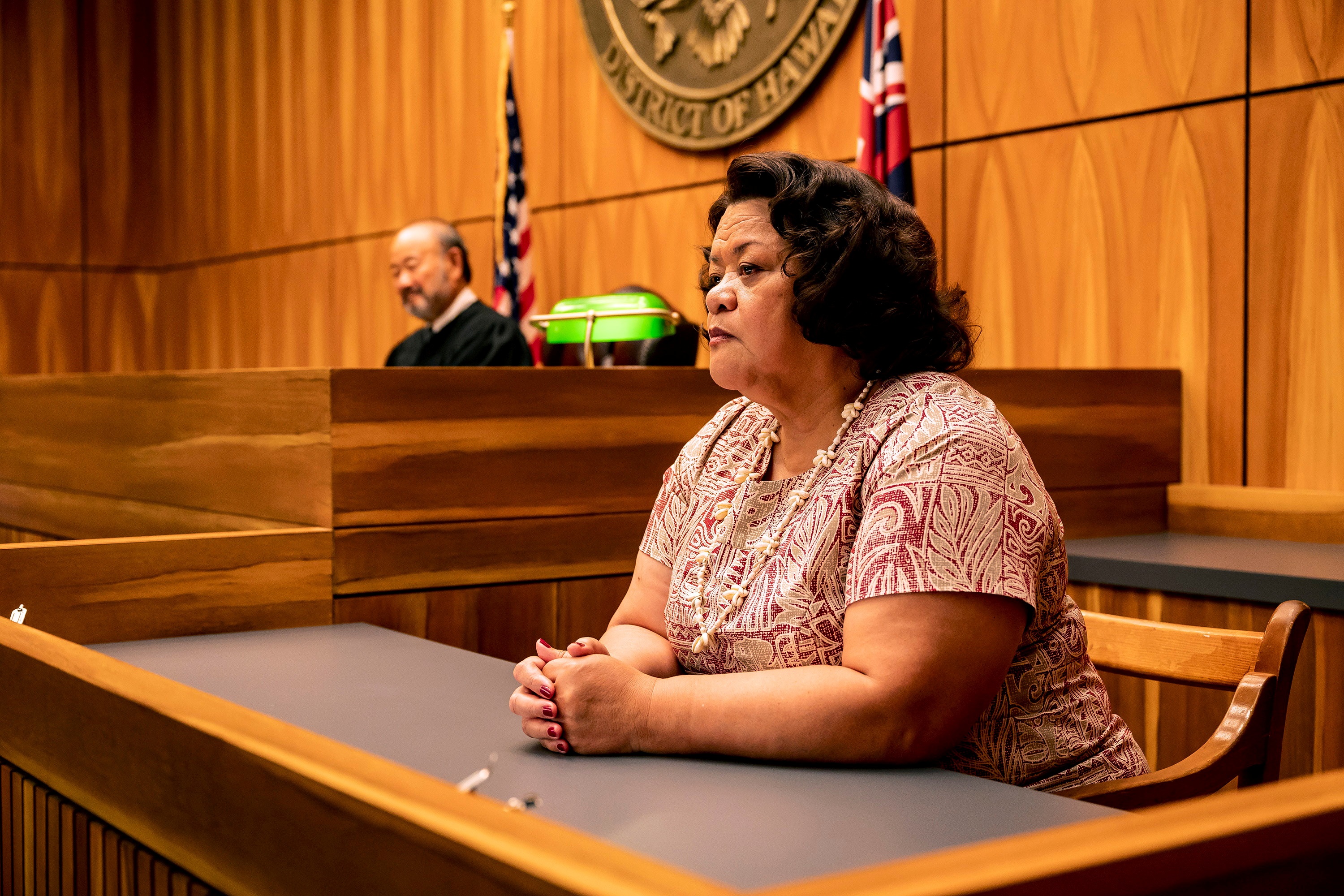 Woman in court with judge in background HD Wallpaper