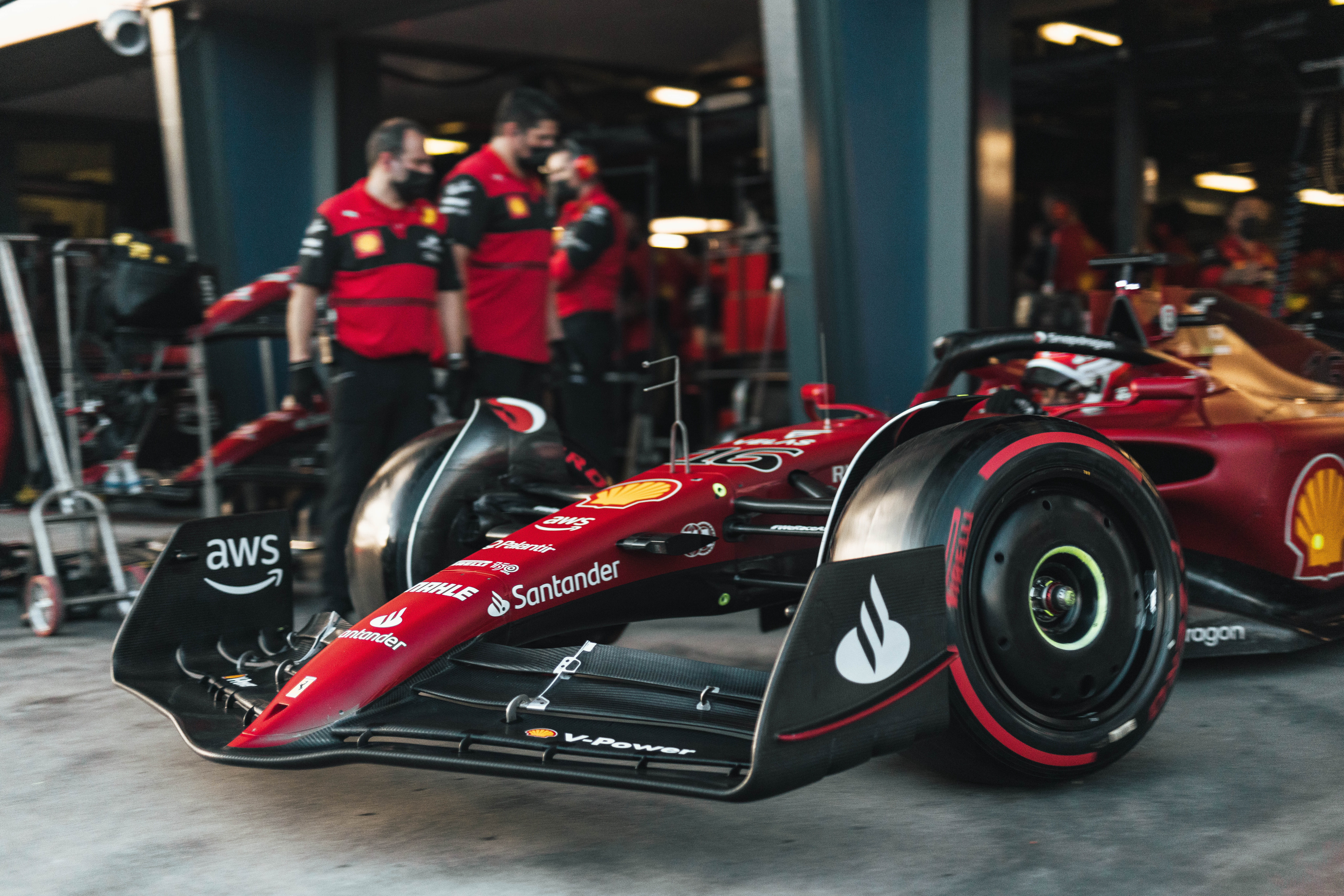 Scuderia Ferrari Formula 1 car in pit garage HD Wallpaper