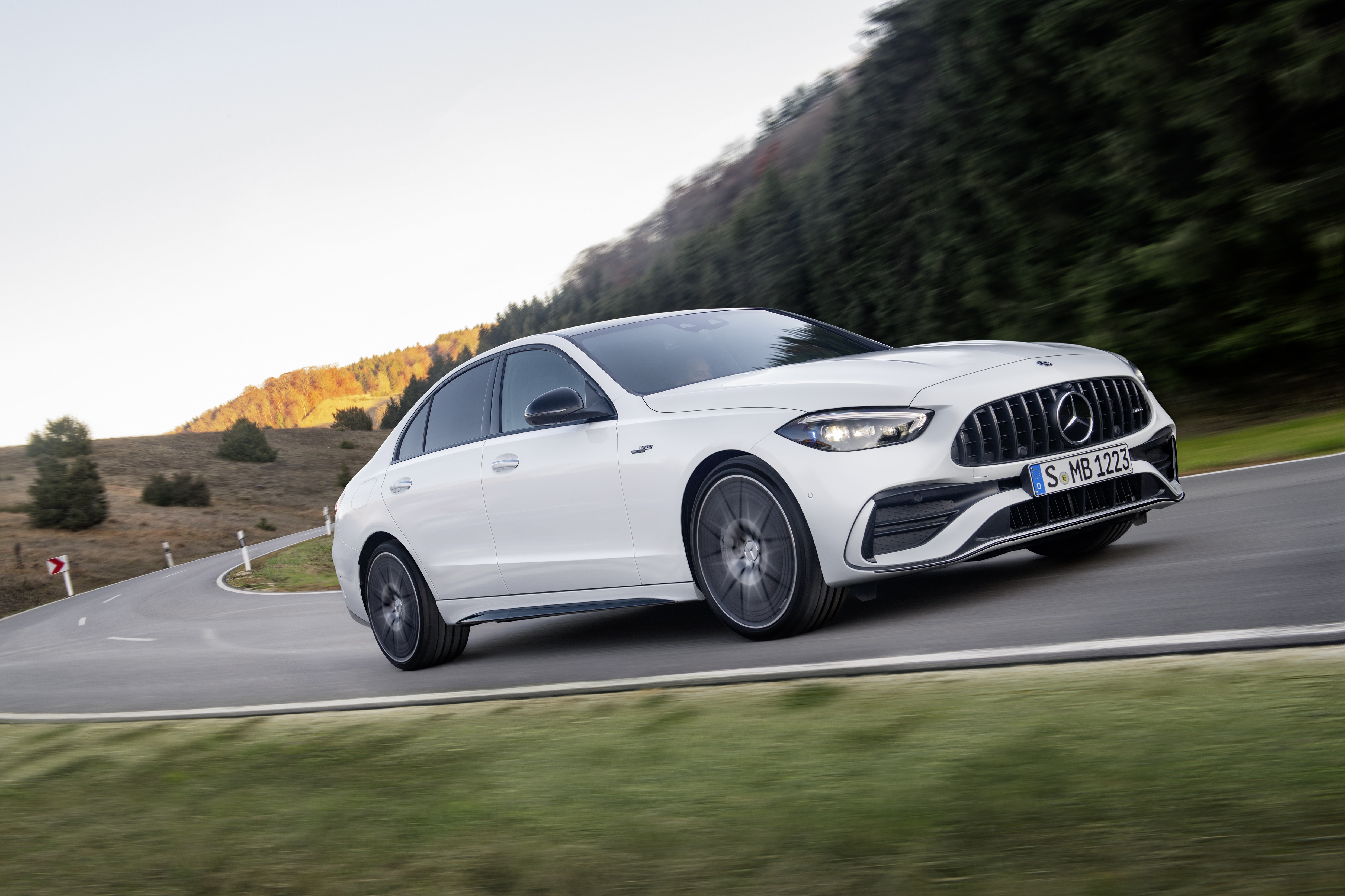 White Mercedes-AMG C 43 4K driving on a winding road HD Wallpaper